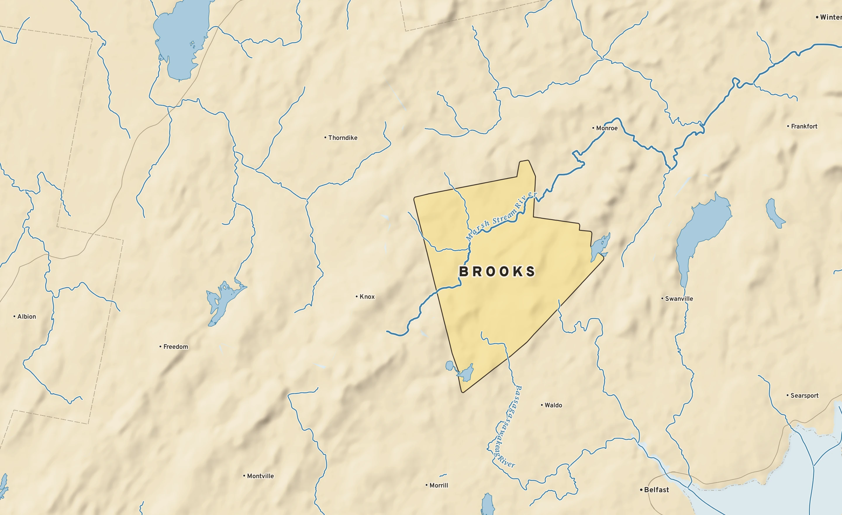Shaded-relief atlas plate of Brooks, Maine: rivers, roads, the city limits and where the water drains.