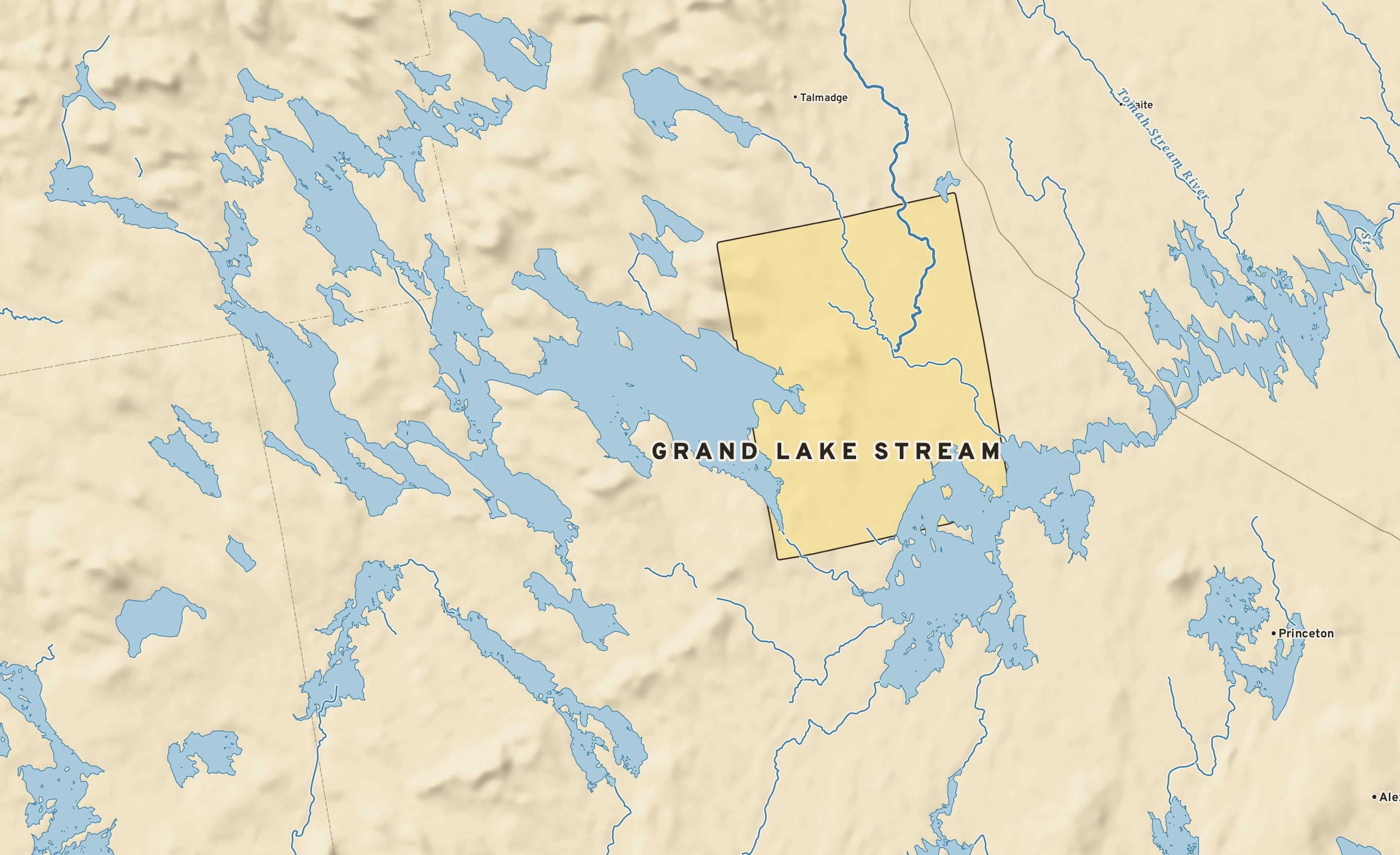Shaded-relief atlas plate of Grand Lake Stream, Maine: rivers, roads, the city limits and where the water drains.