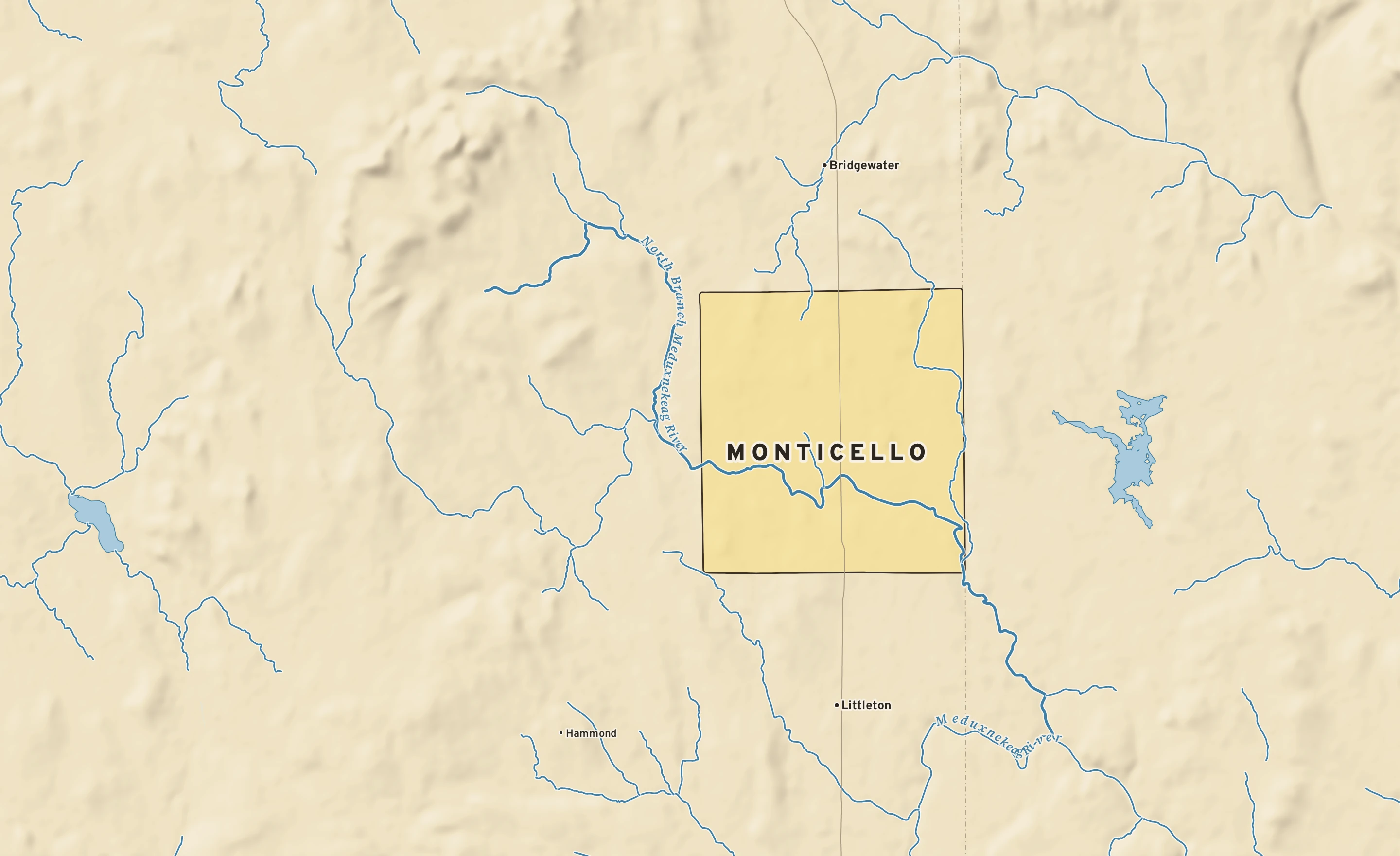 Shaded-relief atlas plate of Monticello, Maine: rivers, roads, the city limits and where the water drains.