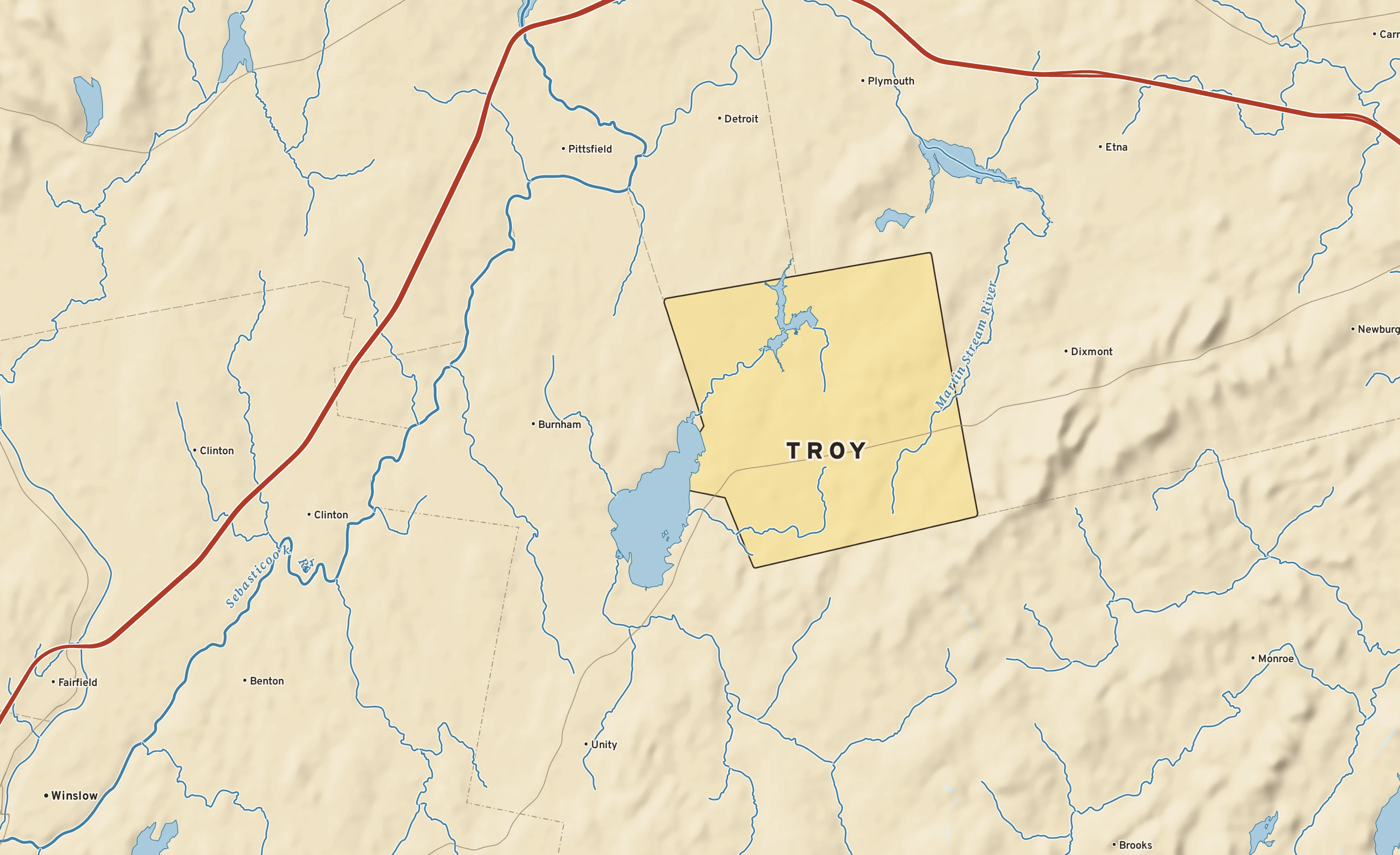 Shaded-relief atlas plate of Troy, Maine: rivers, roads, the city limits and where the water drains.