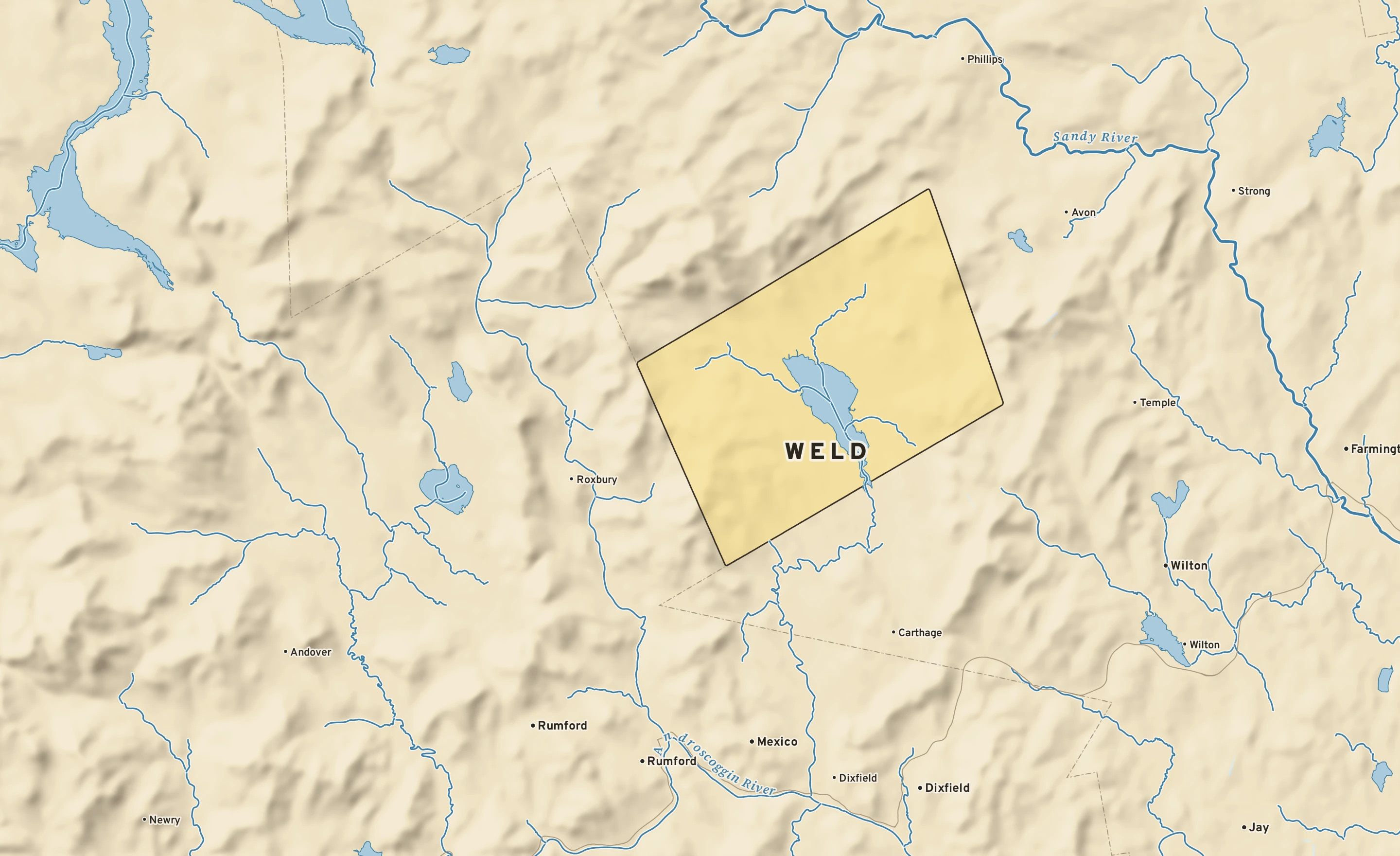 Shaded-relief atlas plate of Weld, Maine: rivers, roads, the city limits and where the water drains.