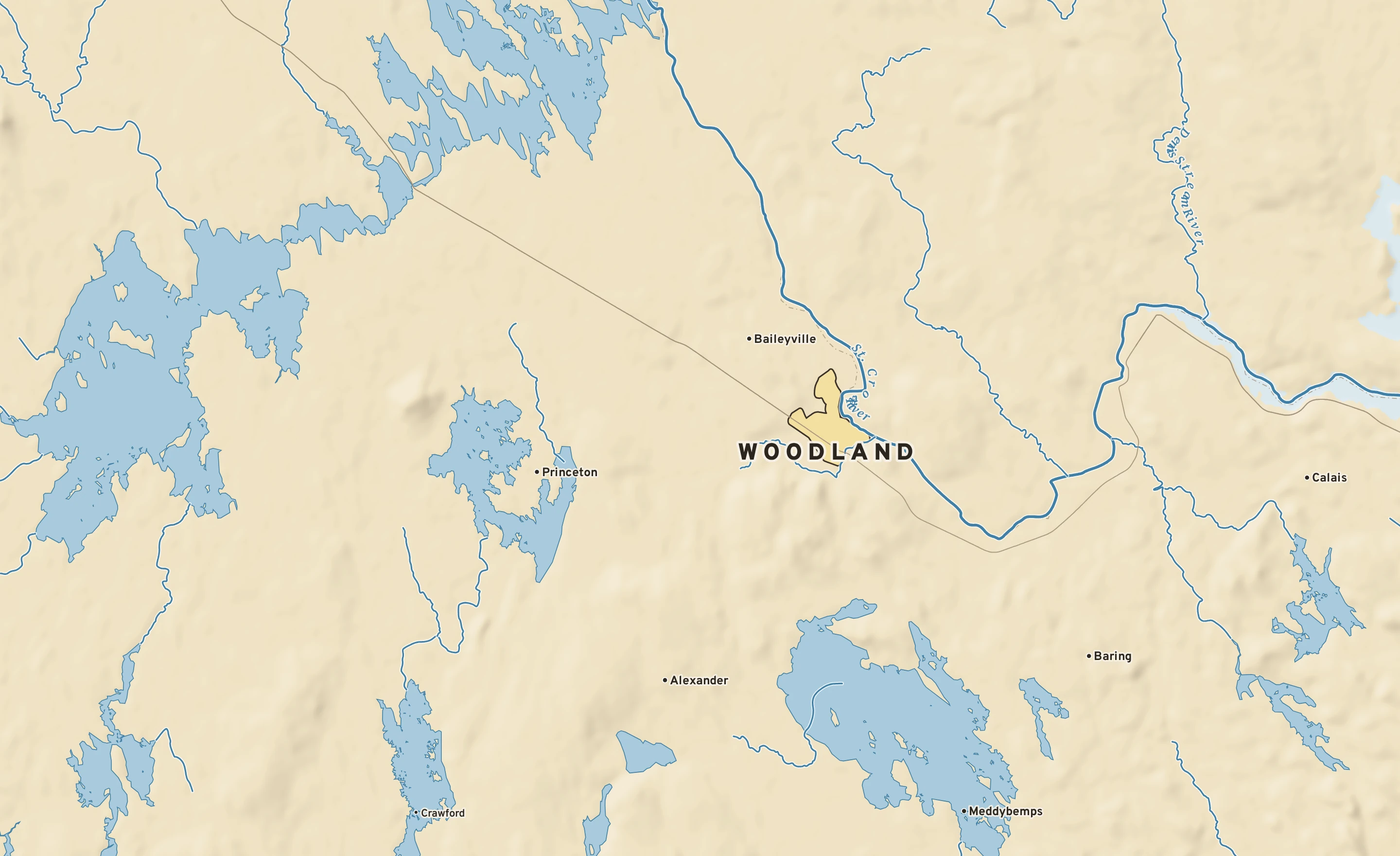 Shaded-relief atlas plate of Woodland, Maine: rivers, roads, the city limits and where the water drains.