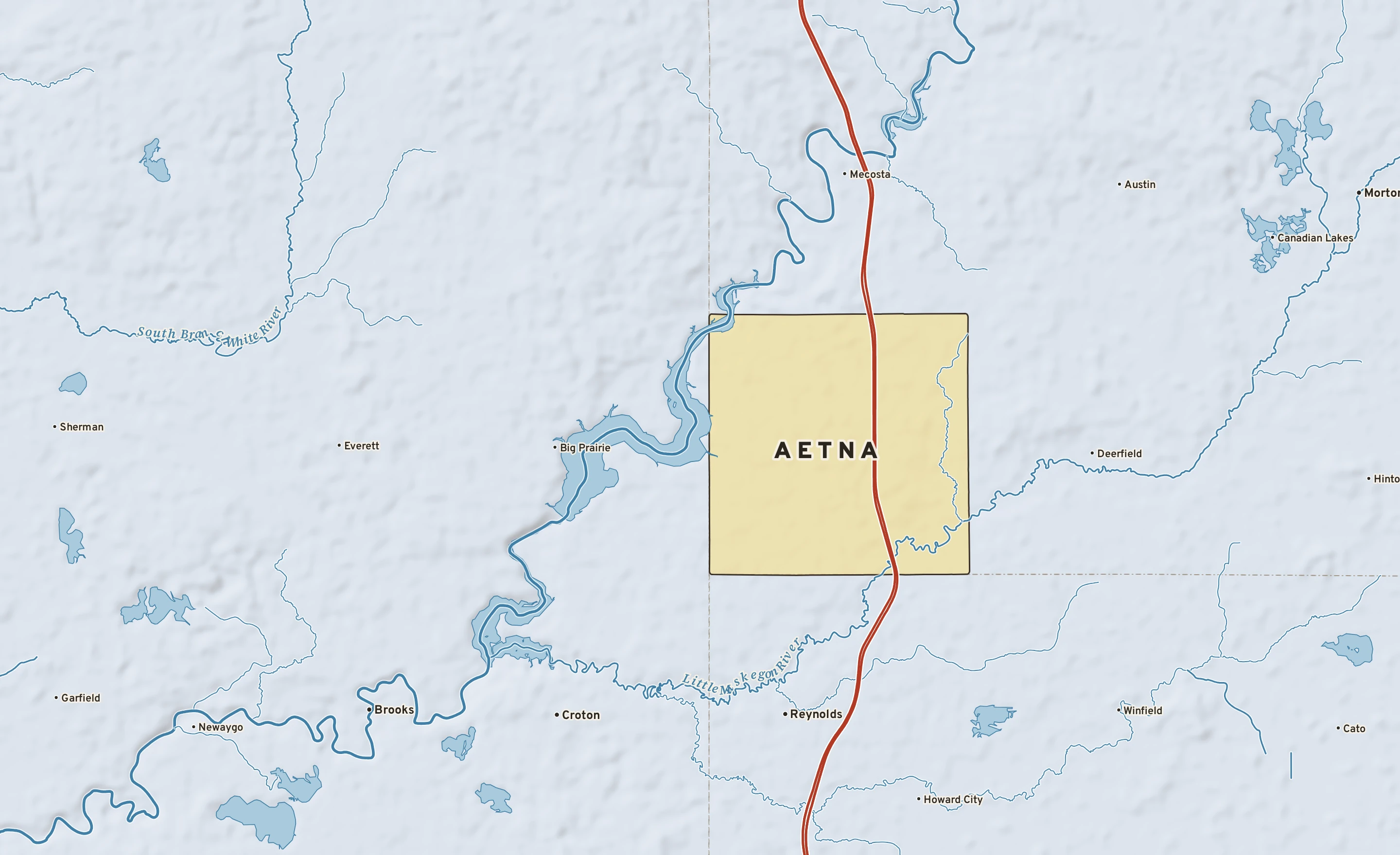 Shaded-relief atlas plate of Aetna, Michigan: rivers, roads, the city limits and where the water drains.