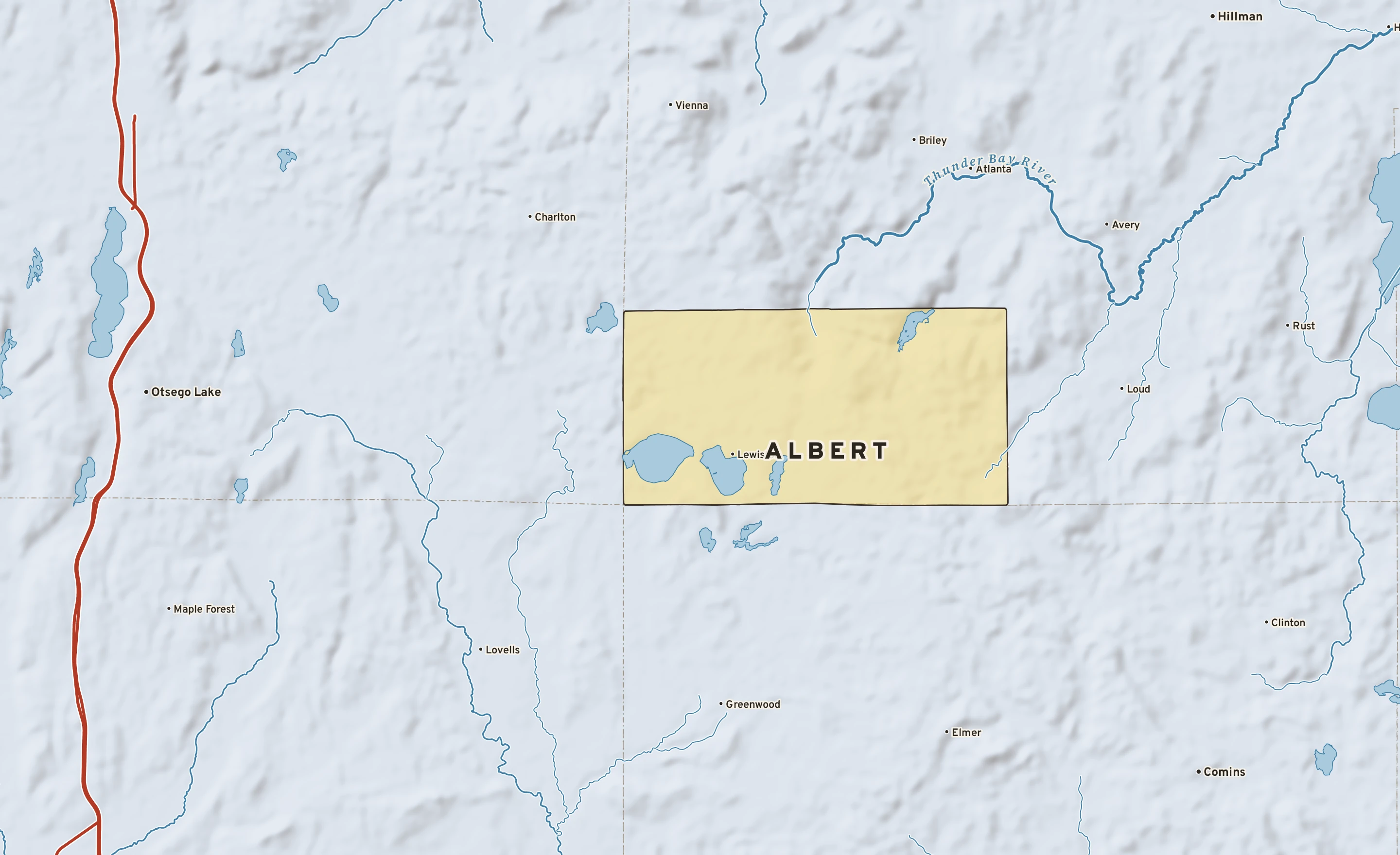 Shaded-relief atlas plate of Albert, Michigan: rivers, roads, the city limits and where the water drains.