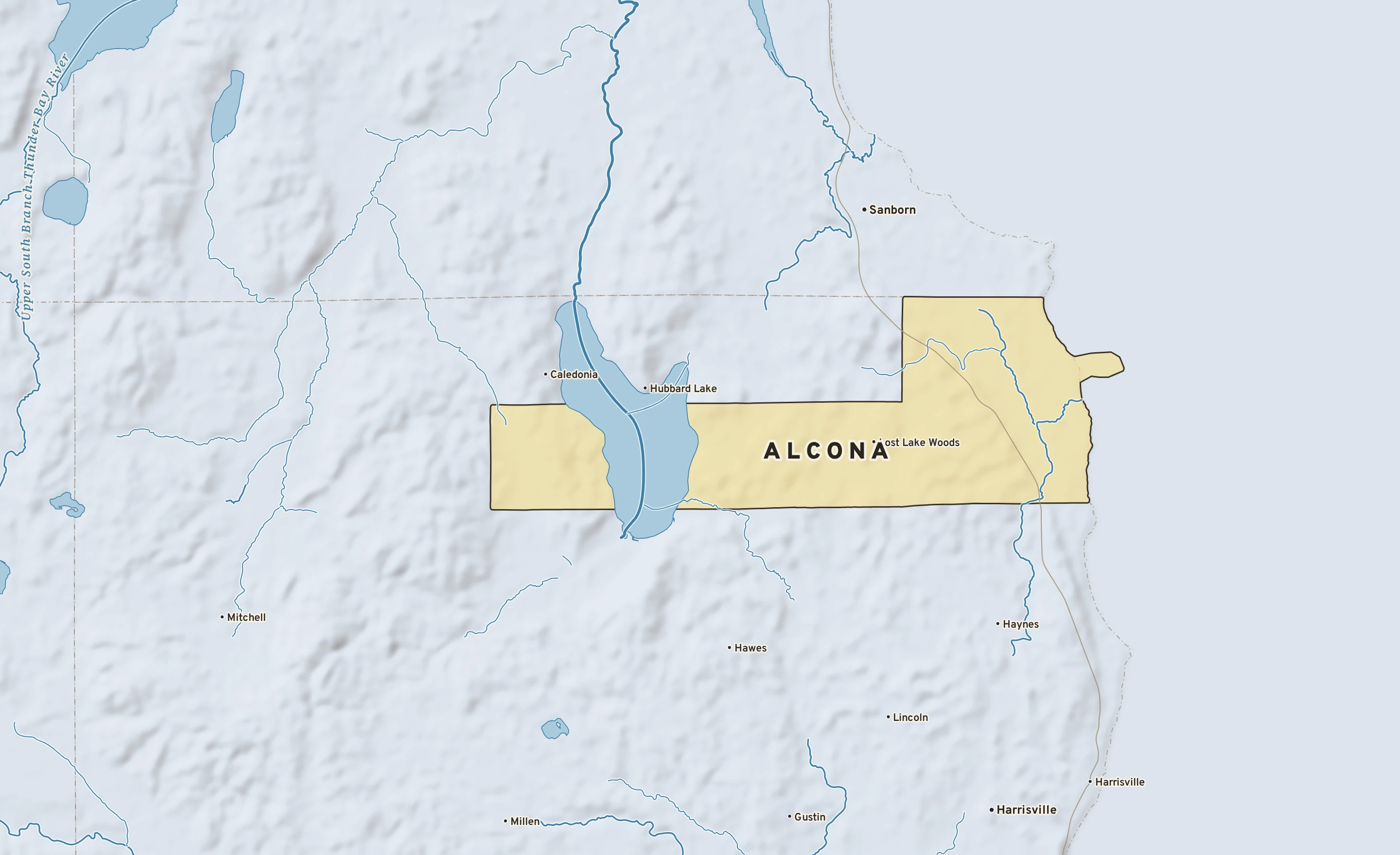 Shaded-relief atlas plate of Alcona, Michigan: rivers, roads, the city limits and where the water drains.