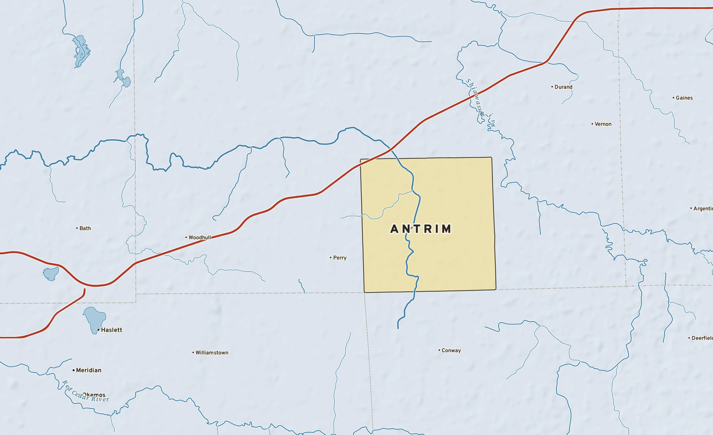 Shaded-relief atlas plate of Antrim, Michigan: rivers, roads, the city limits and where the water drains.