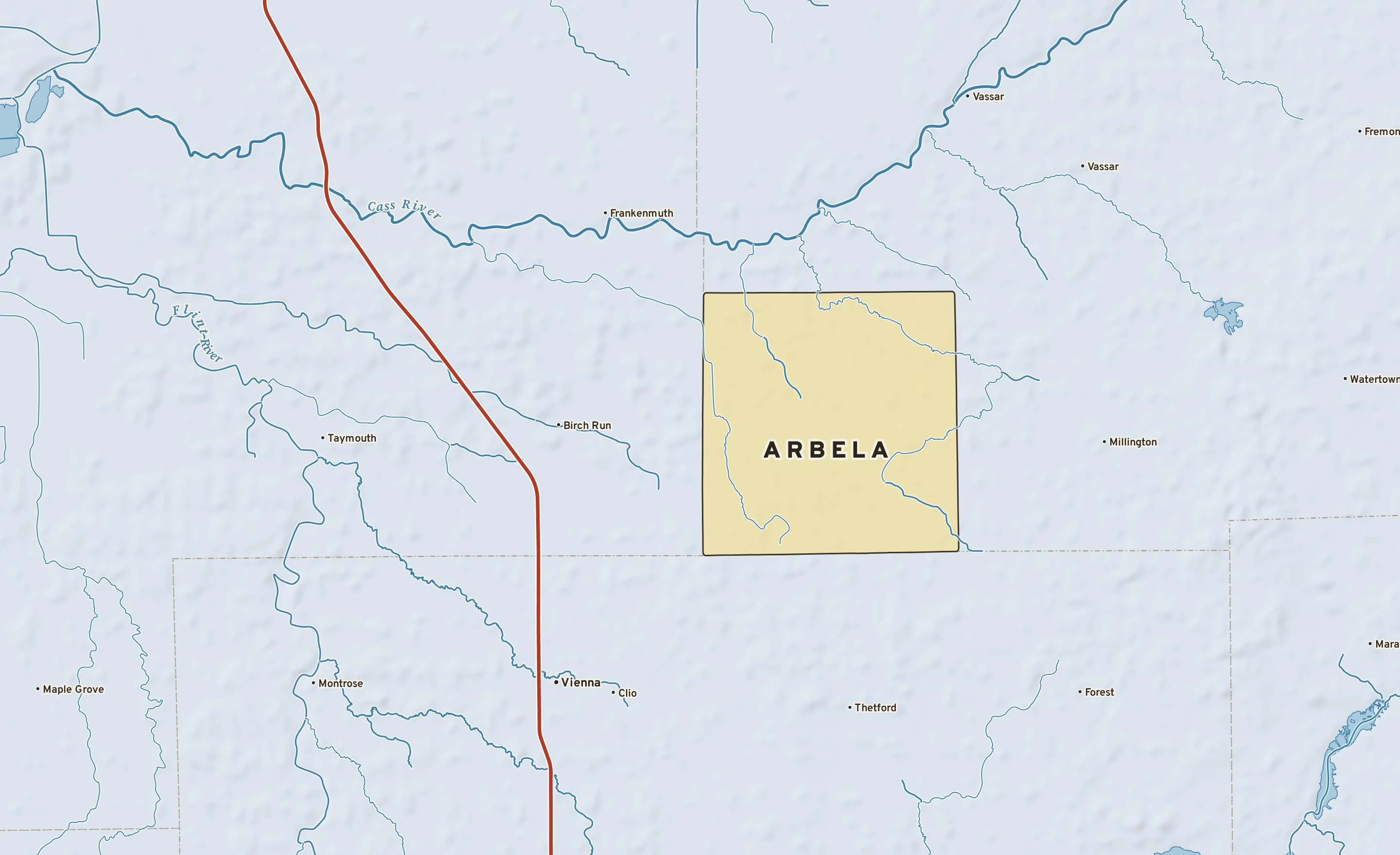 Shaded-relief atlas plate of Arbela, Michigan: rivers, roads, the city limits and where the water drains.