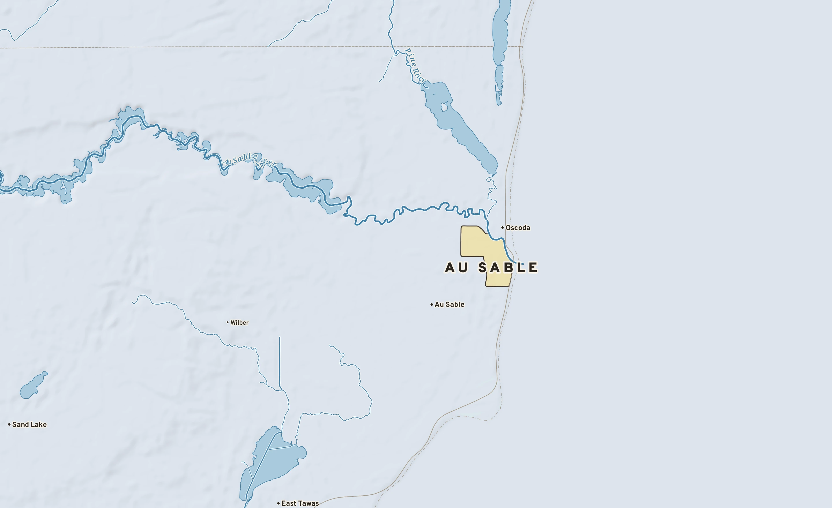 Shaded-relief atlas plate of Au Sable, Michigan: rivers, roads, the city limits and where the water drains.