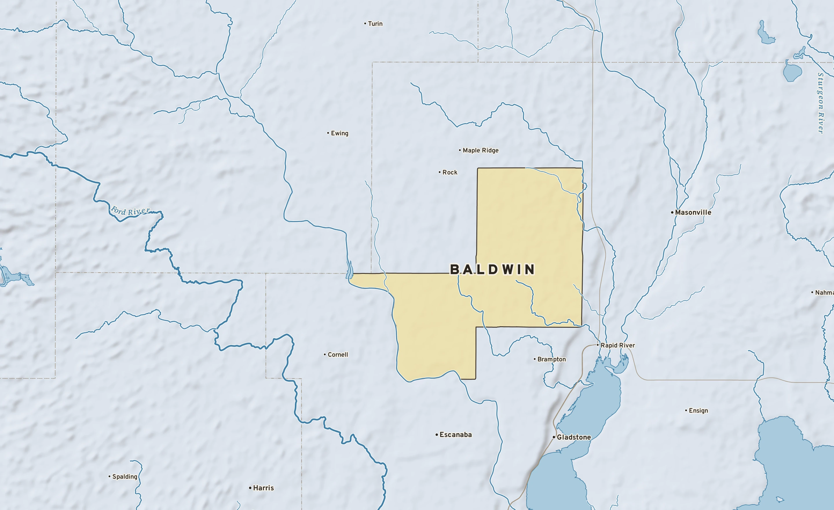 Shaded-relief atlas plate of Baldwin, Michigan: rivers, roads, the city limits and where the water drains.