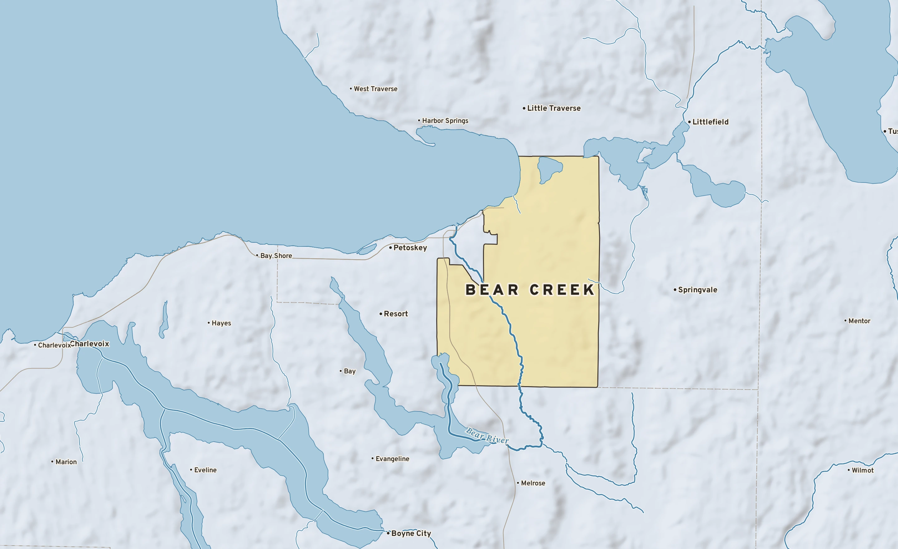 Shaded-relief atlas plate of Bear Creek, Michigan: rivers, roads, the city limits and where the water drains.
