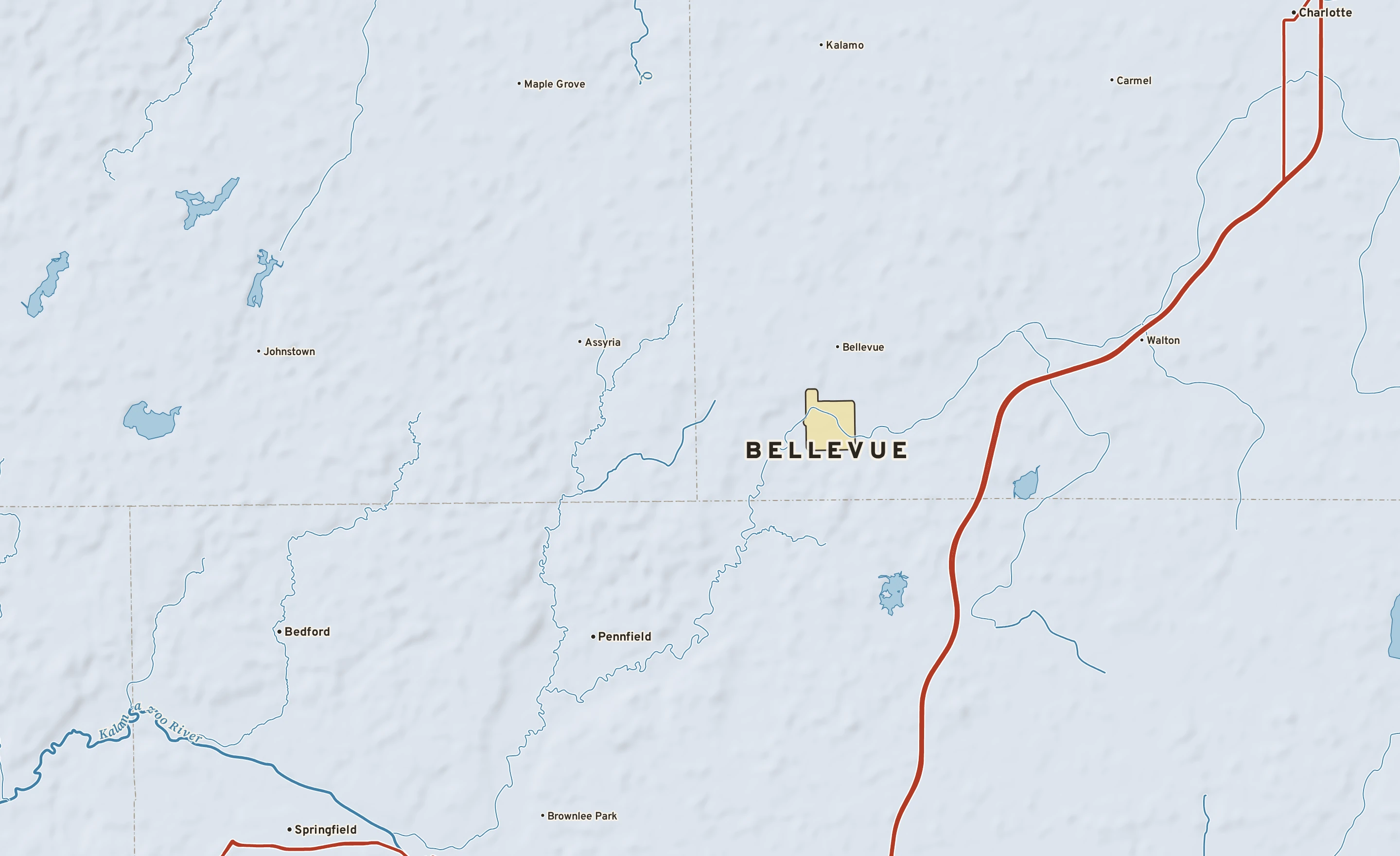 Shaded-relief atlas plate of Bellevue, Michigan: rivers, roads, the city limits and where the water drains.