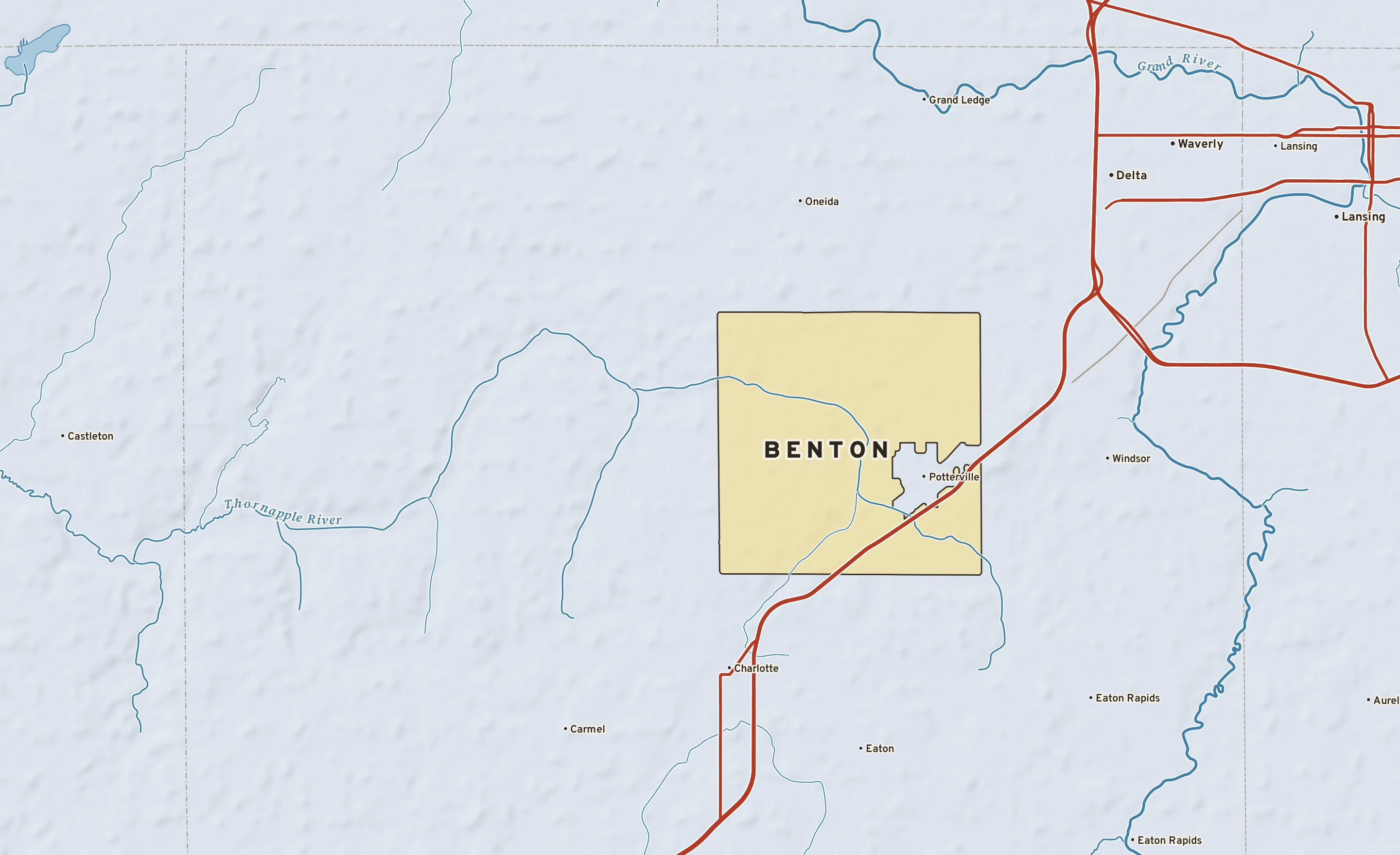 Shaded-relief atlas plate of Benton, Michigan: rivers, roads, the city limits and where the water drains.