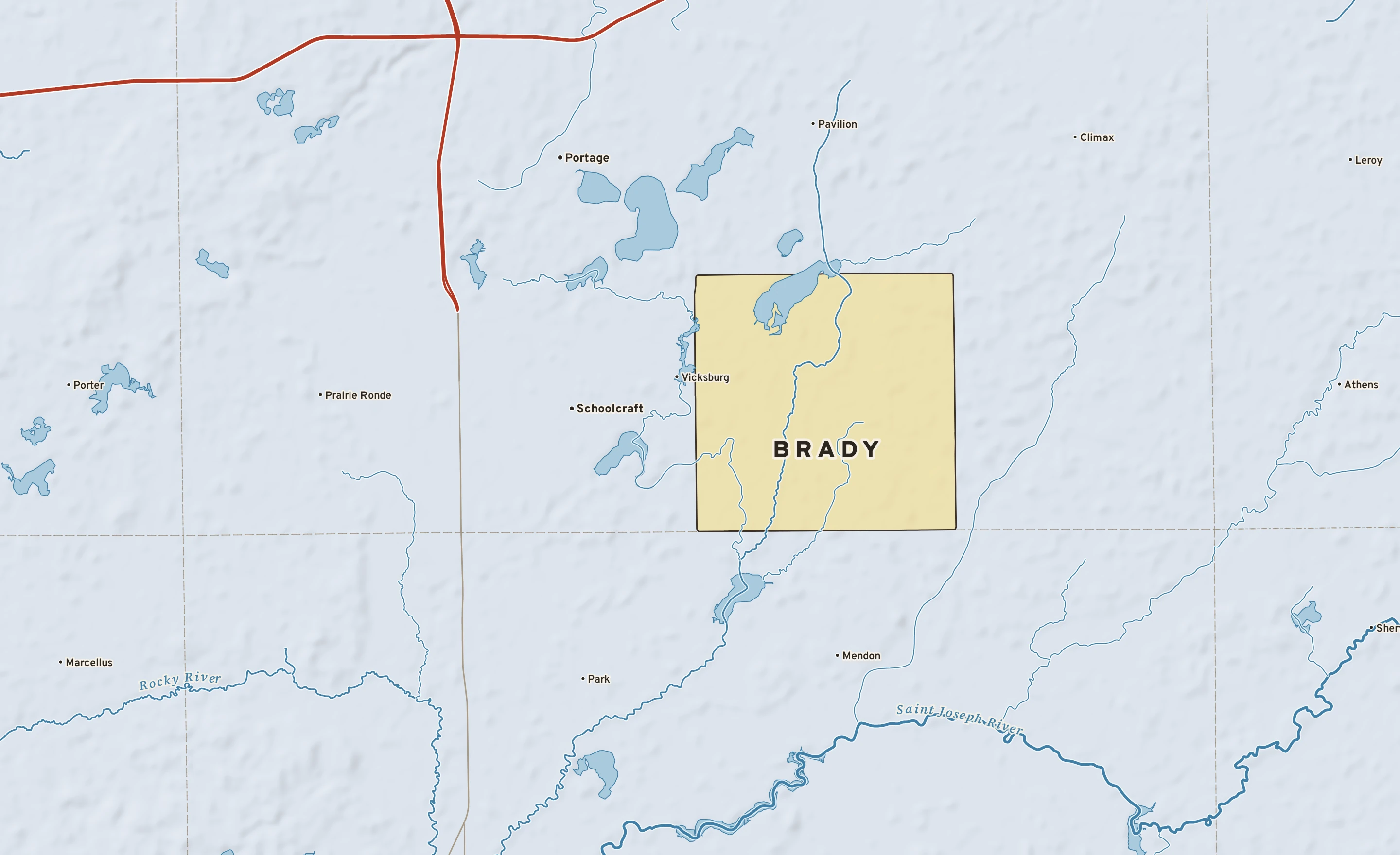Shaded-relief atlas plate of Brady, Michigan: rivers, roads, the city limits and where the water drains.