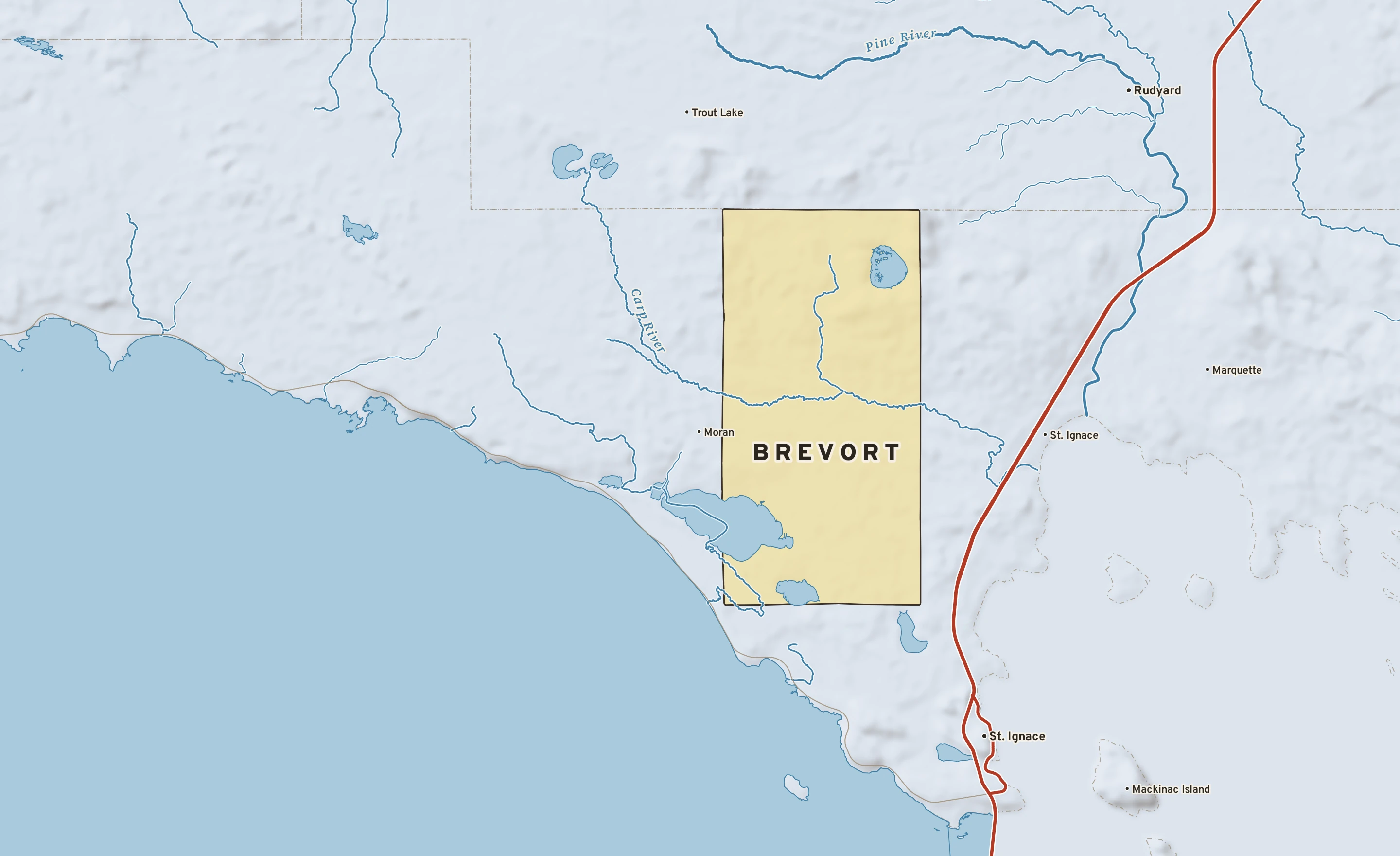 Shaded-relief atlas plate of Brevort, Michigan: rivers, roads, the city limits and where the water drains.