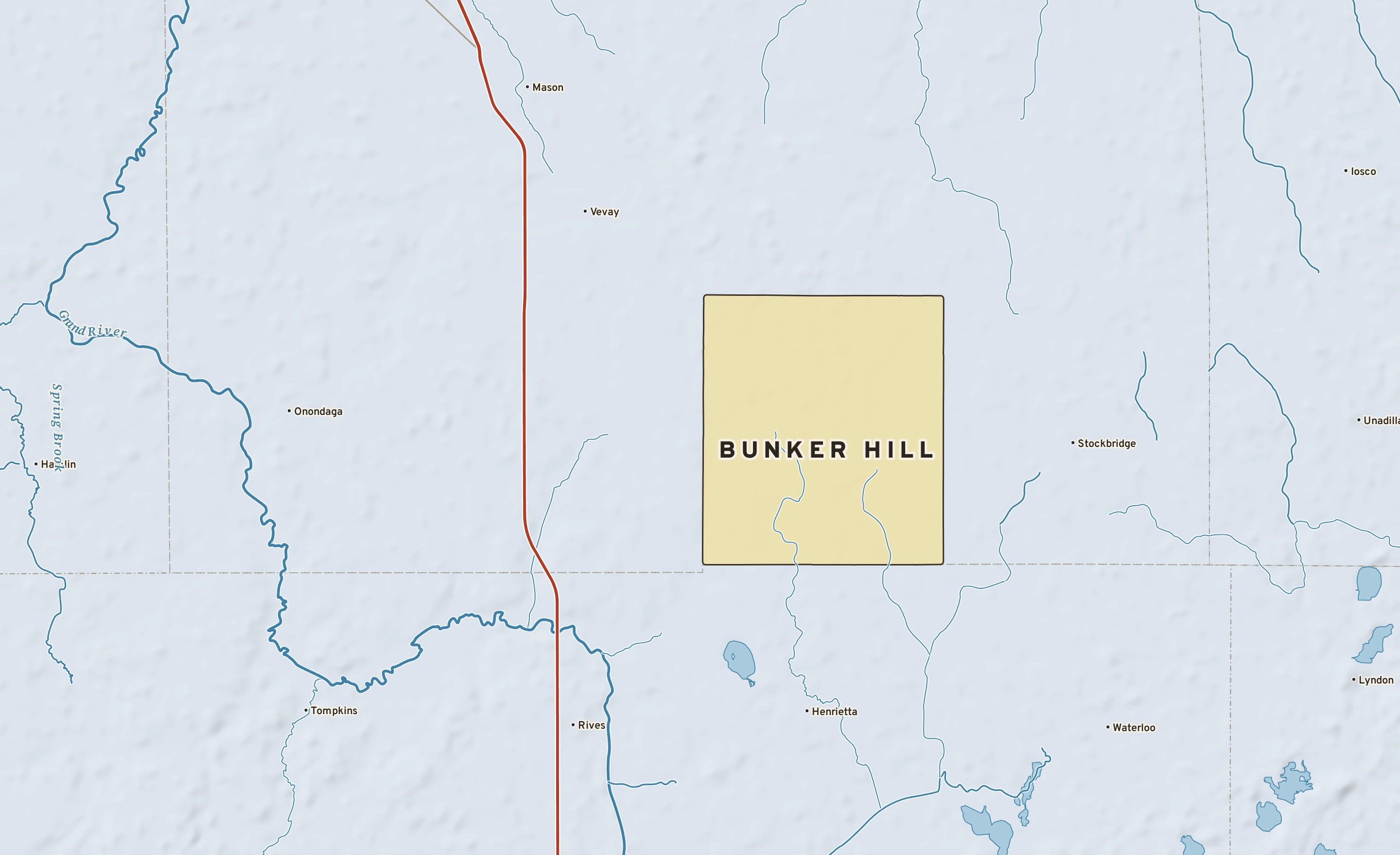 Shaded-relief atlas plate of Bunker Hill, Michigan: rivers, roads, the city limits and where the water drains.