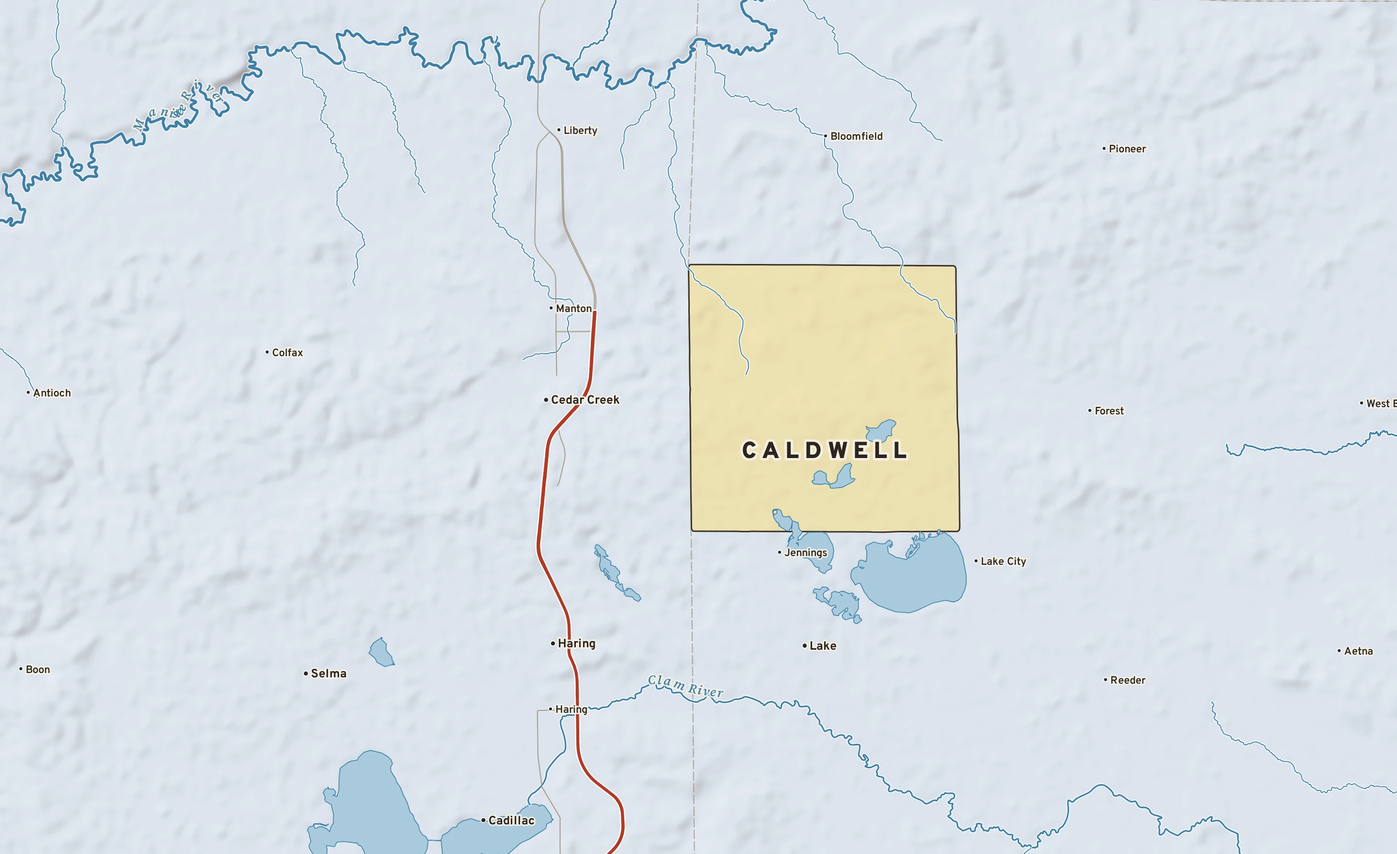Shaded-relief atlas plate of Caldwell, Michigan: rivers, roads, the city limits and where the water drains.
