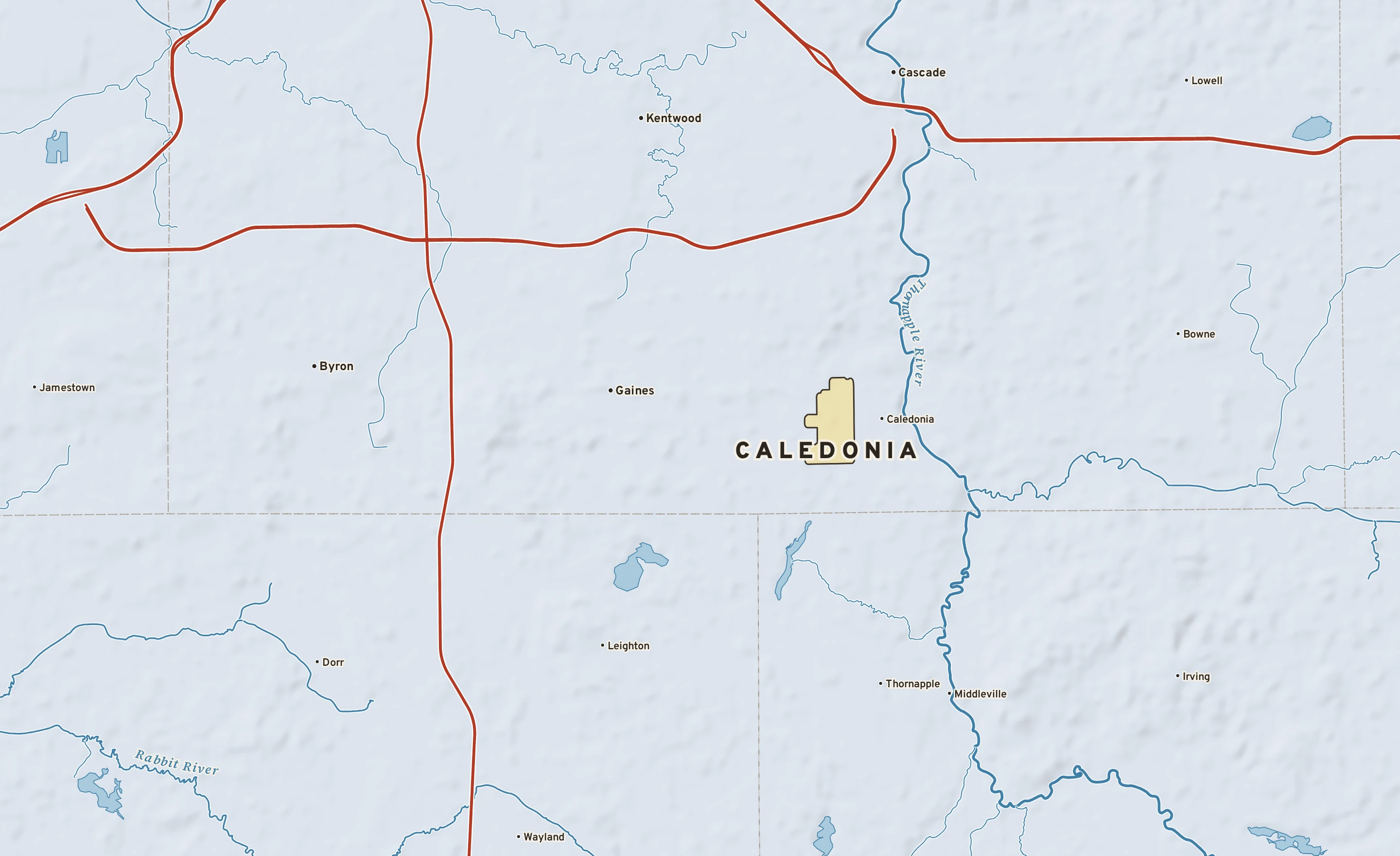 Shaded-relief atlas plate of Caledonia, Michigan: rivers, roads, the city limits and where the water drains.
