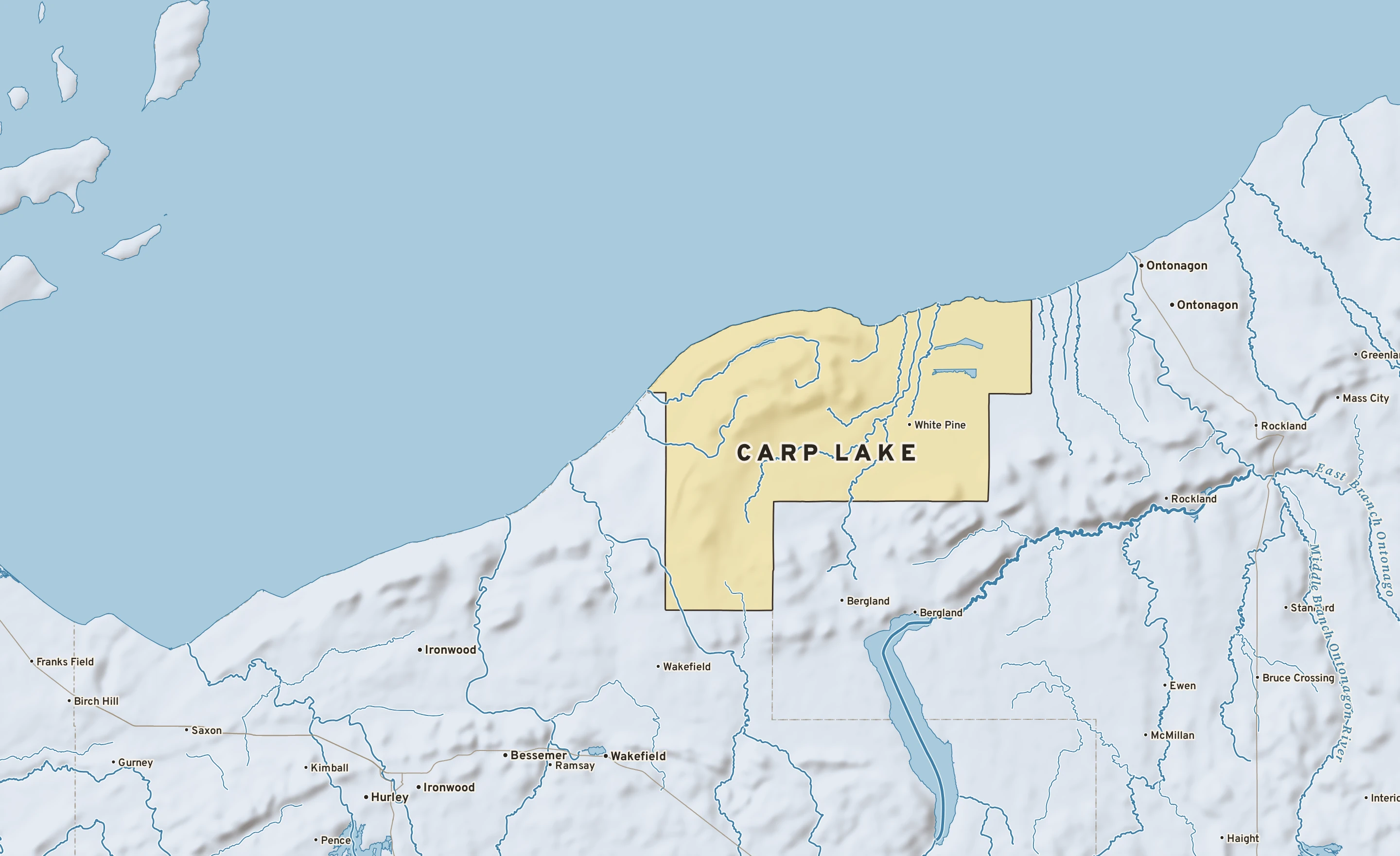 Shaded-relief atlas plate of Carp Lake, Michigan: rivers, roads, the city limits and where the water drains.