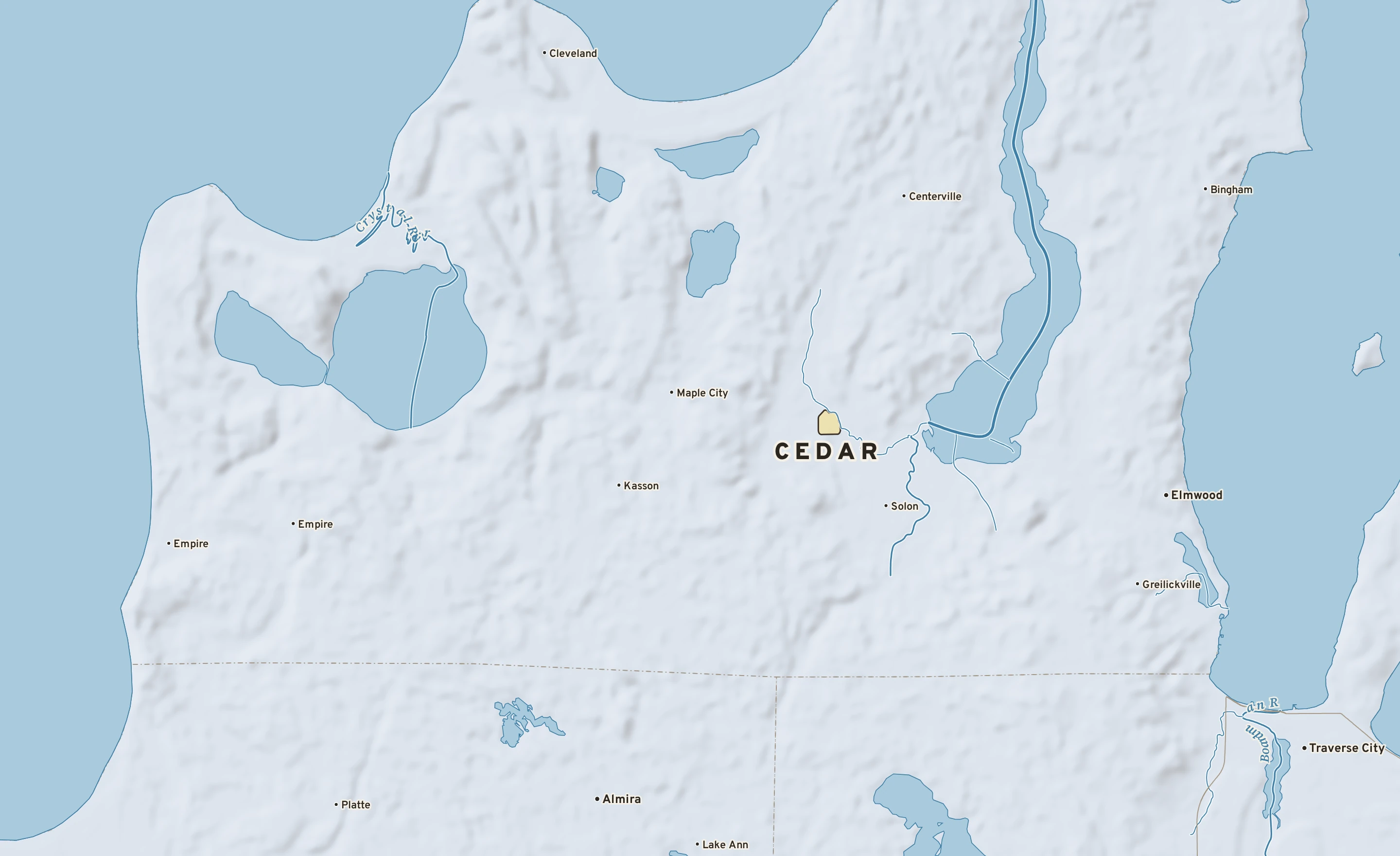 Shaded-relief atlas plate of Cedar, Michigan: rivers, roads, the city limits and where the water drains.