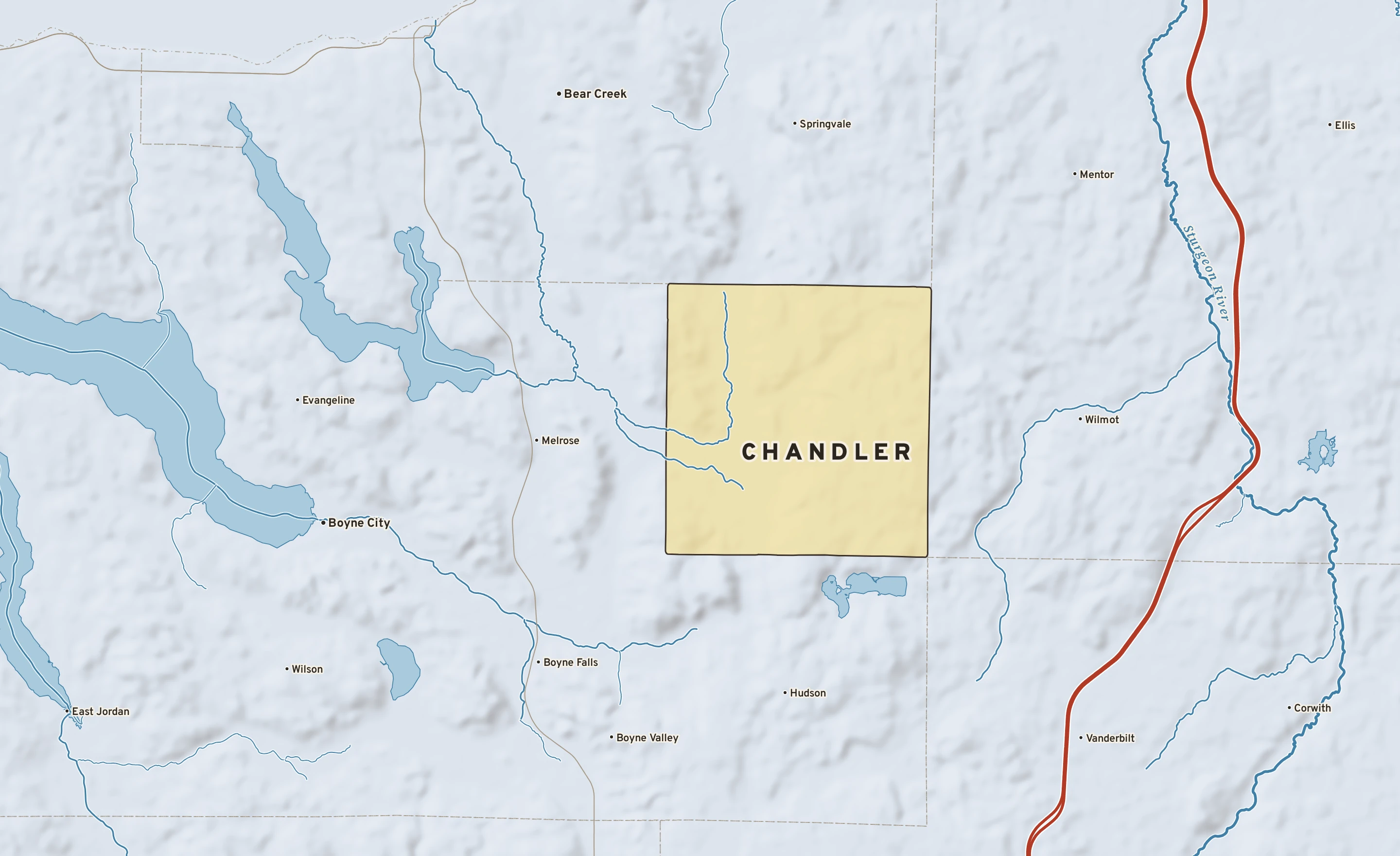 Shaded-relief atlas plate of Chandler, Michigan: rivers, roads, the city limits and where the water drains.