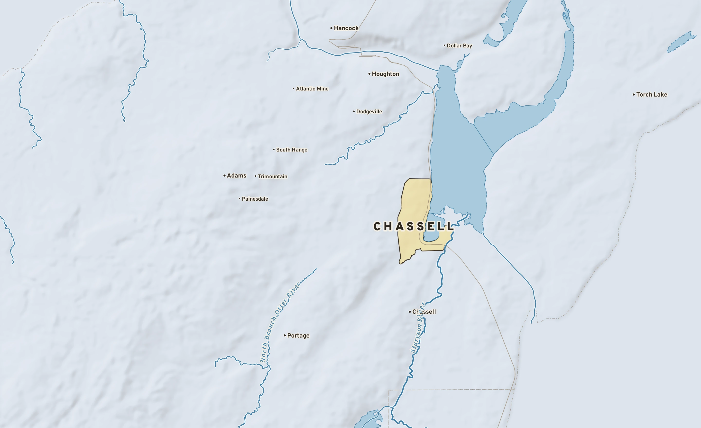 Shaded-relief atlas plate of Chassell, Michigan: rivers, roads, the city limits and where the water drains.