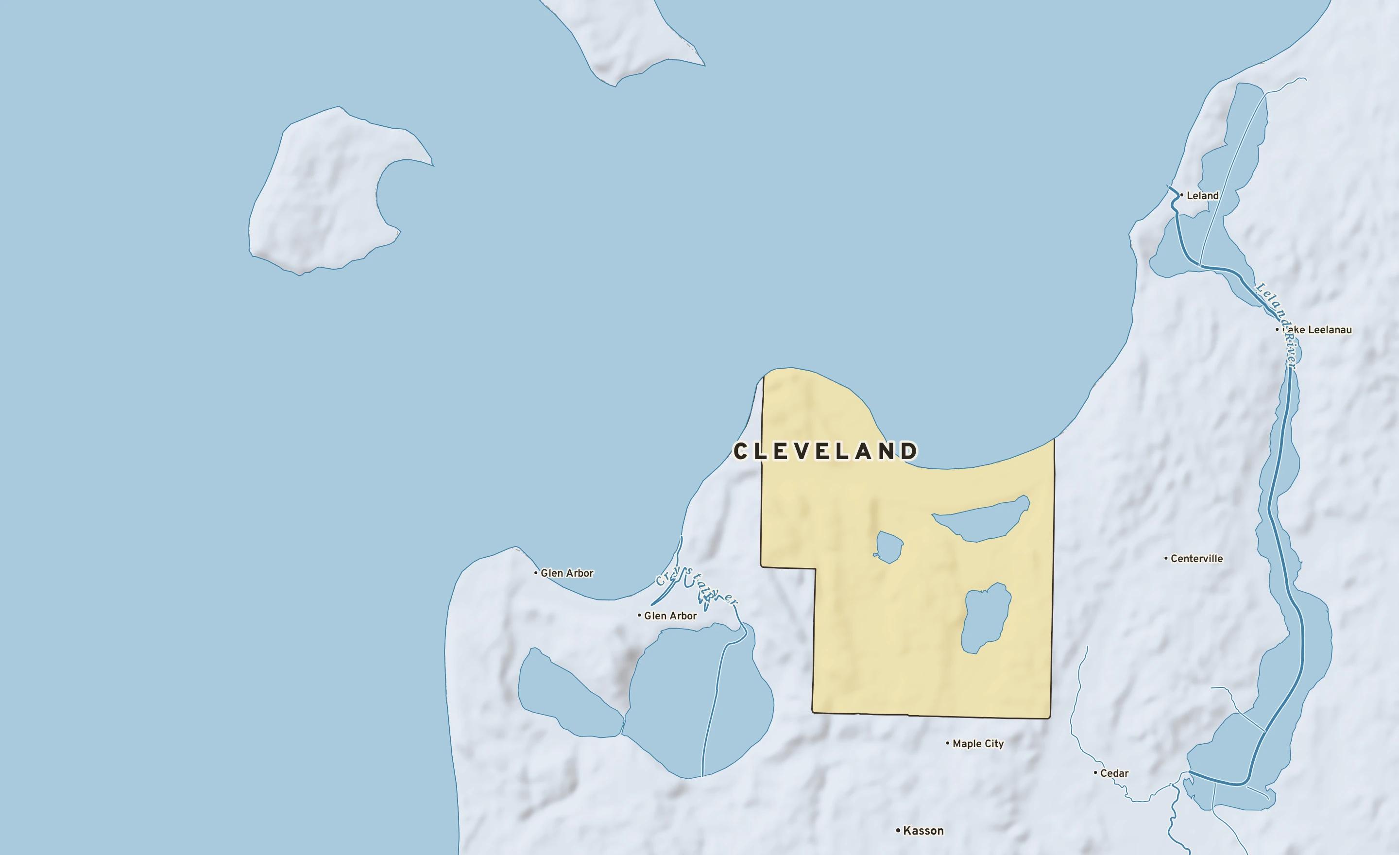 Shaded-relief atlas plate of Cleveland, Michigan: rivers, roads, the city limits and where the water drains.