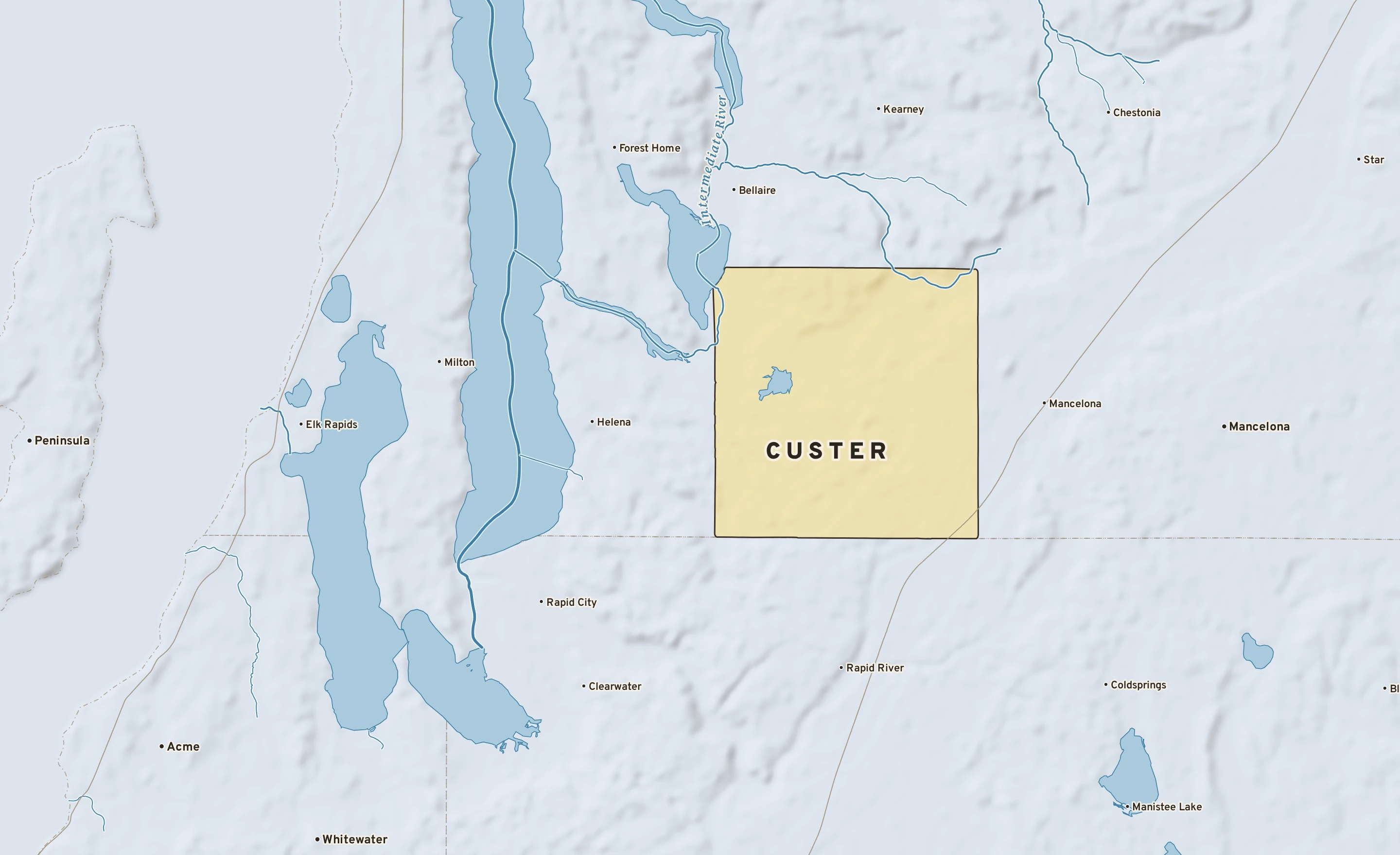 Shaded-relief atlas plate of Custer, Michigan: rivers, roads, the city limits and where the water drains.