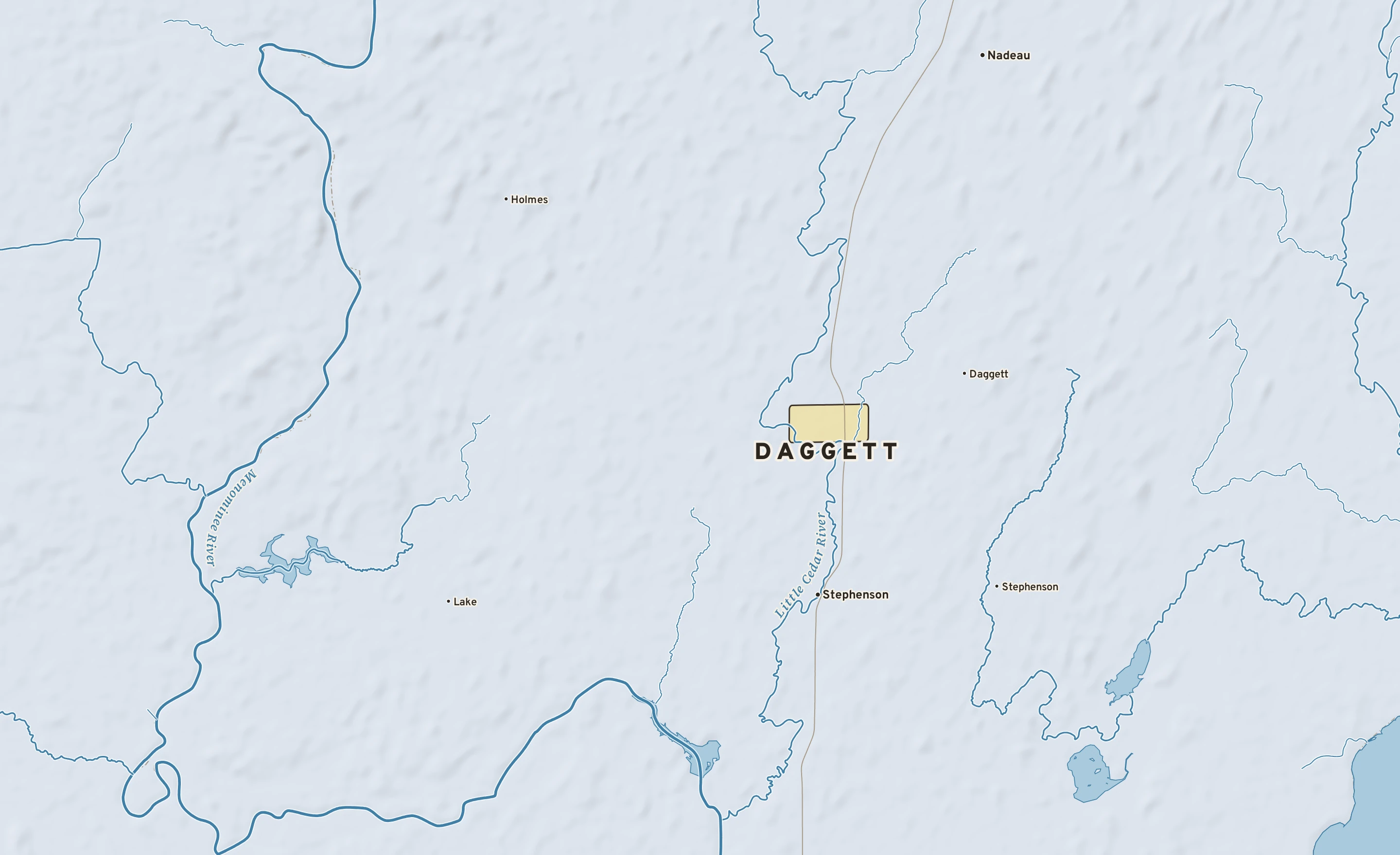 Shaded-relief atlas plate of Daggett, Michigan: rivers, roads, the city limits and where the water drains.