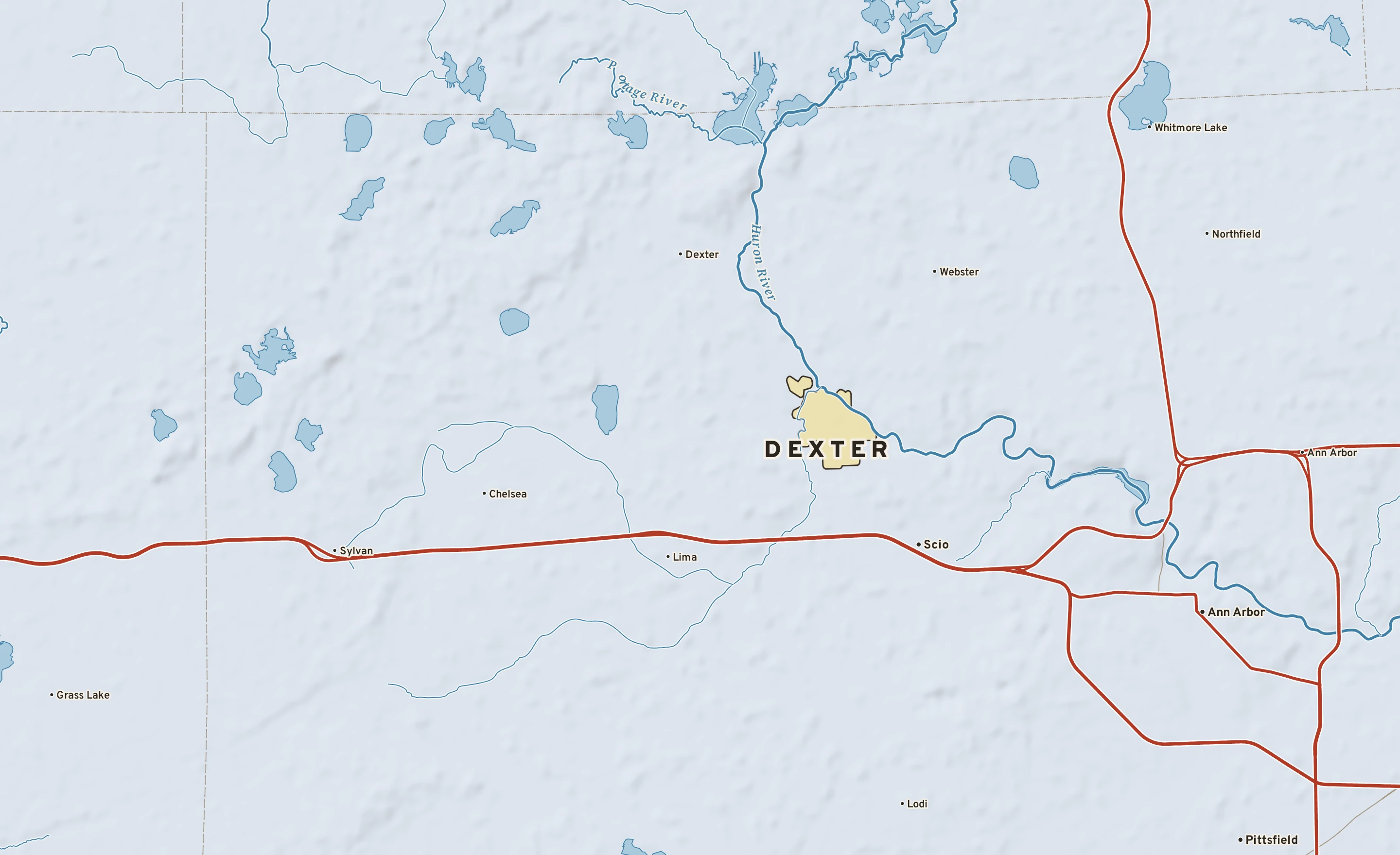 Shaded-relief atlas plate of Dexter, Michigan: rivers, roads, the city limits and where the water drains.