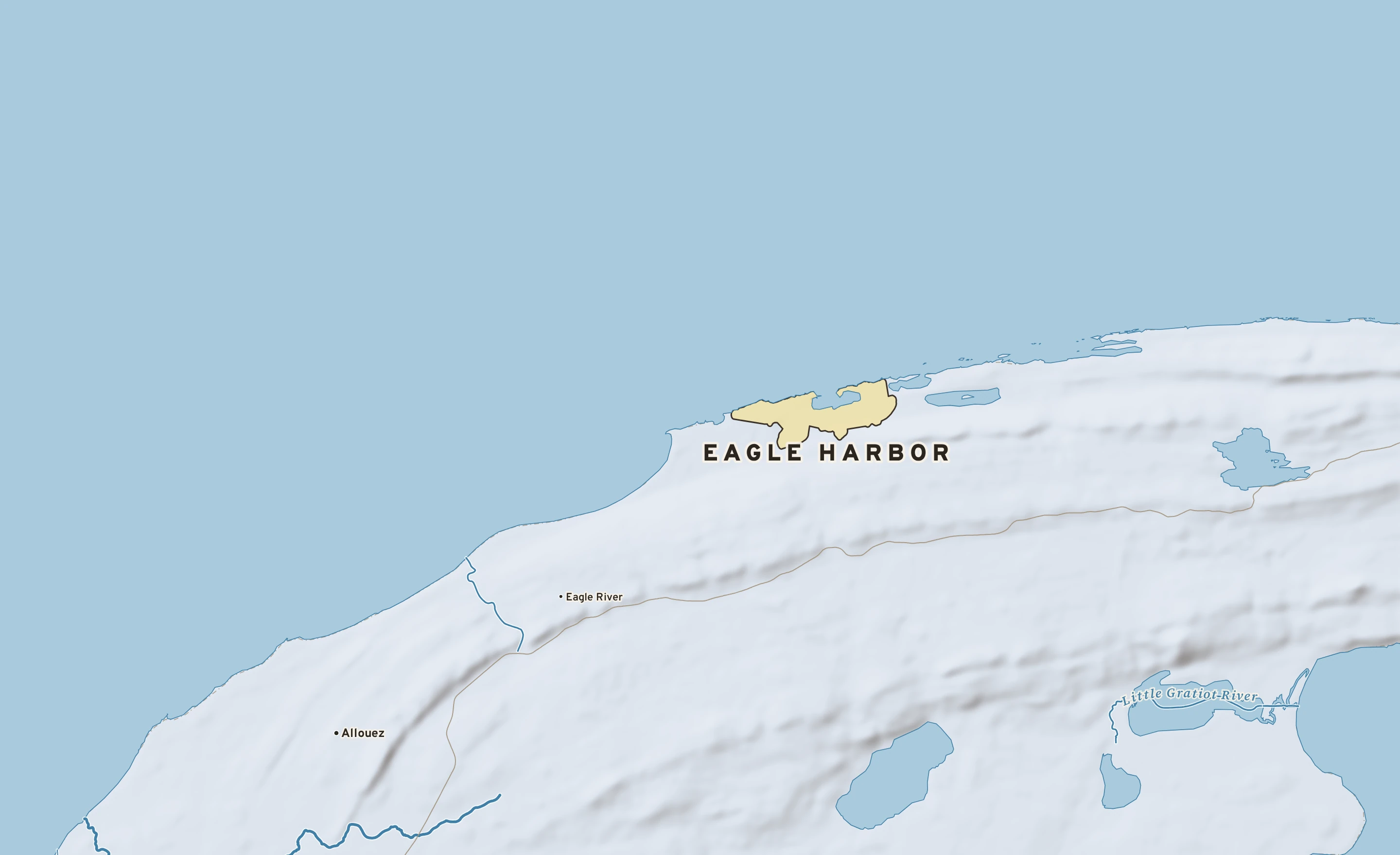 Shaded-relief atlas plate of Eagle Harbor, Michigan: rivers, roads, the city limits and where the water drains.