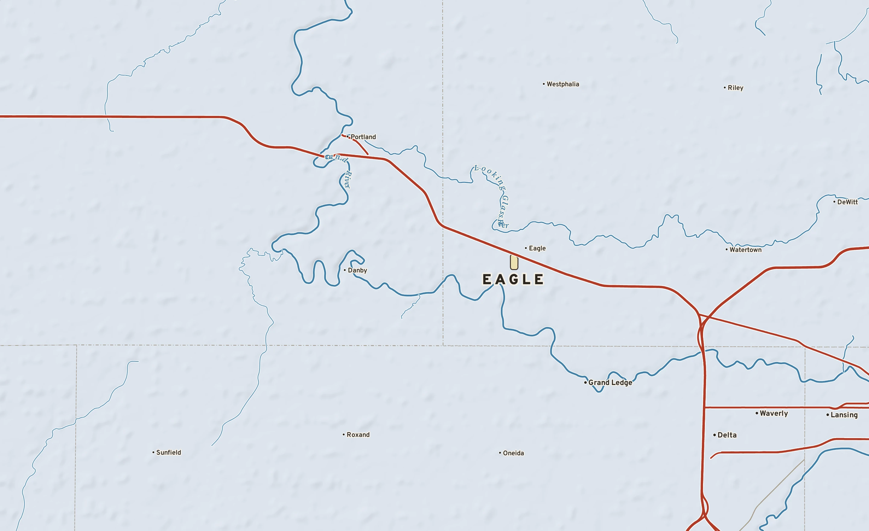Shaded-relief atlas plate of Eagle, Michigan: rivers, roads, the city limits and where the water drains.