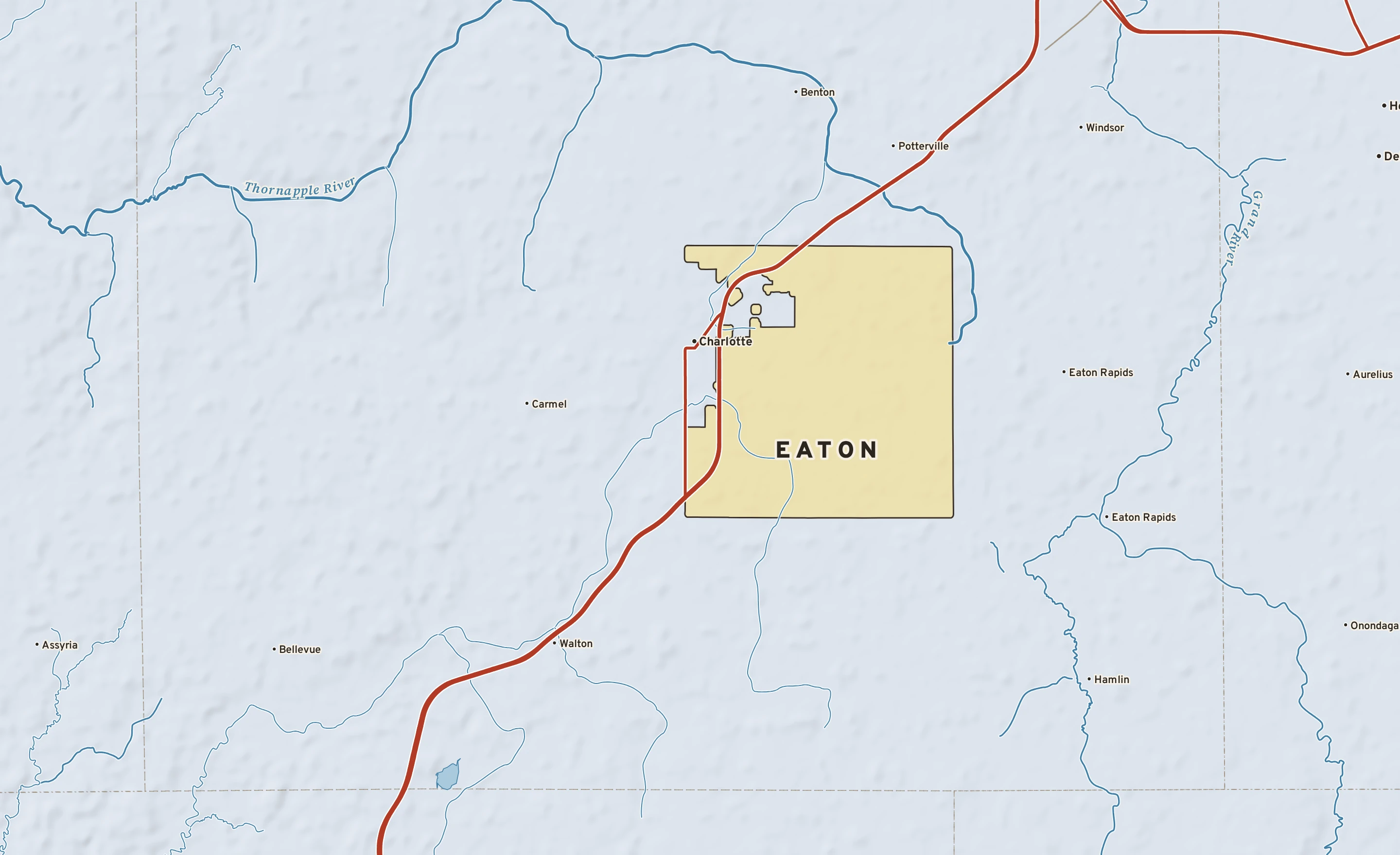 Shaded-relief atlas plate of Eaton, Michigan: rivers, roads, the city limits and where the water drains.