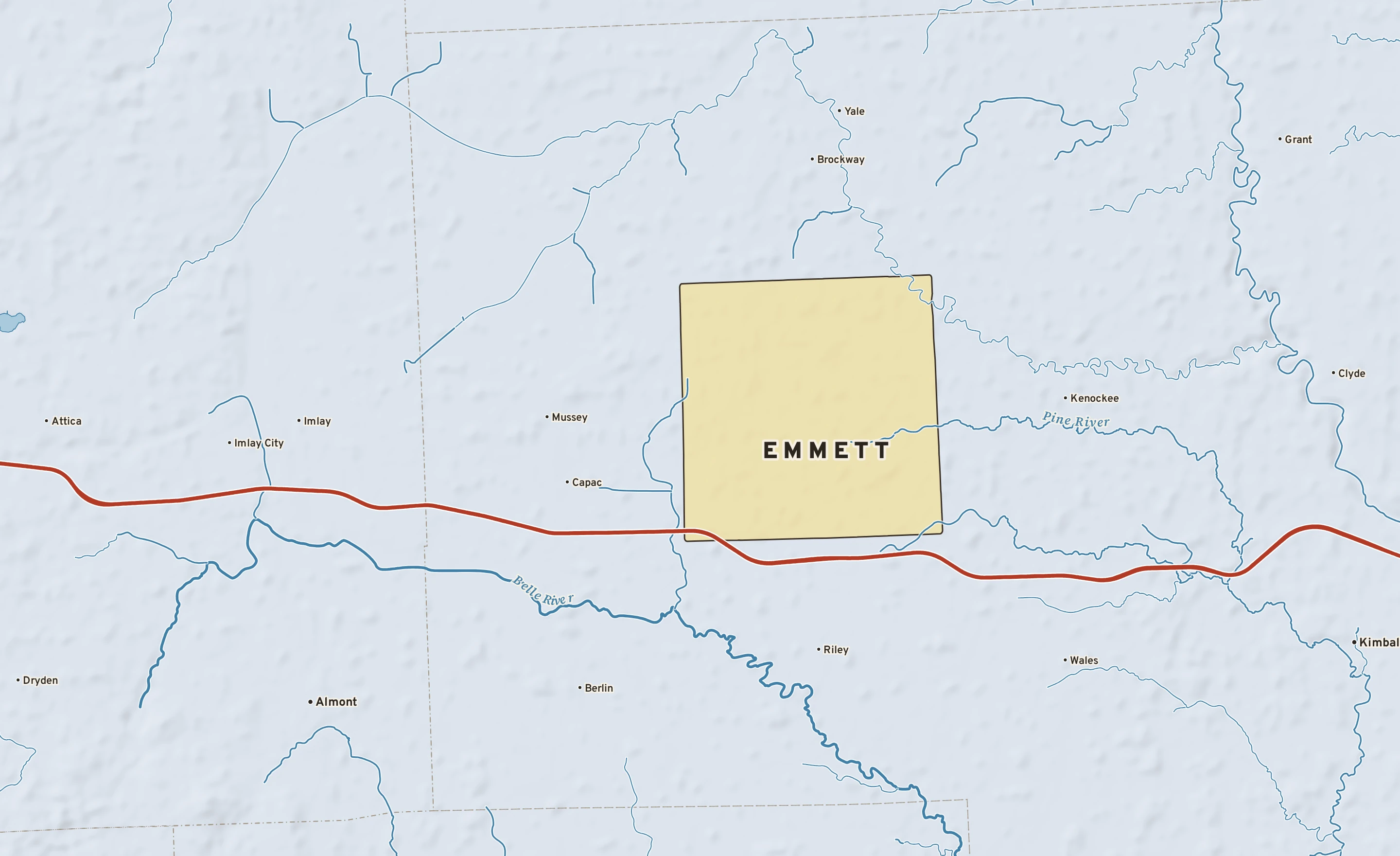 Shaded-relief atlas plate of Emmett, Michigan: rivers, roads, the city limits and where the water drains.
