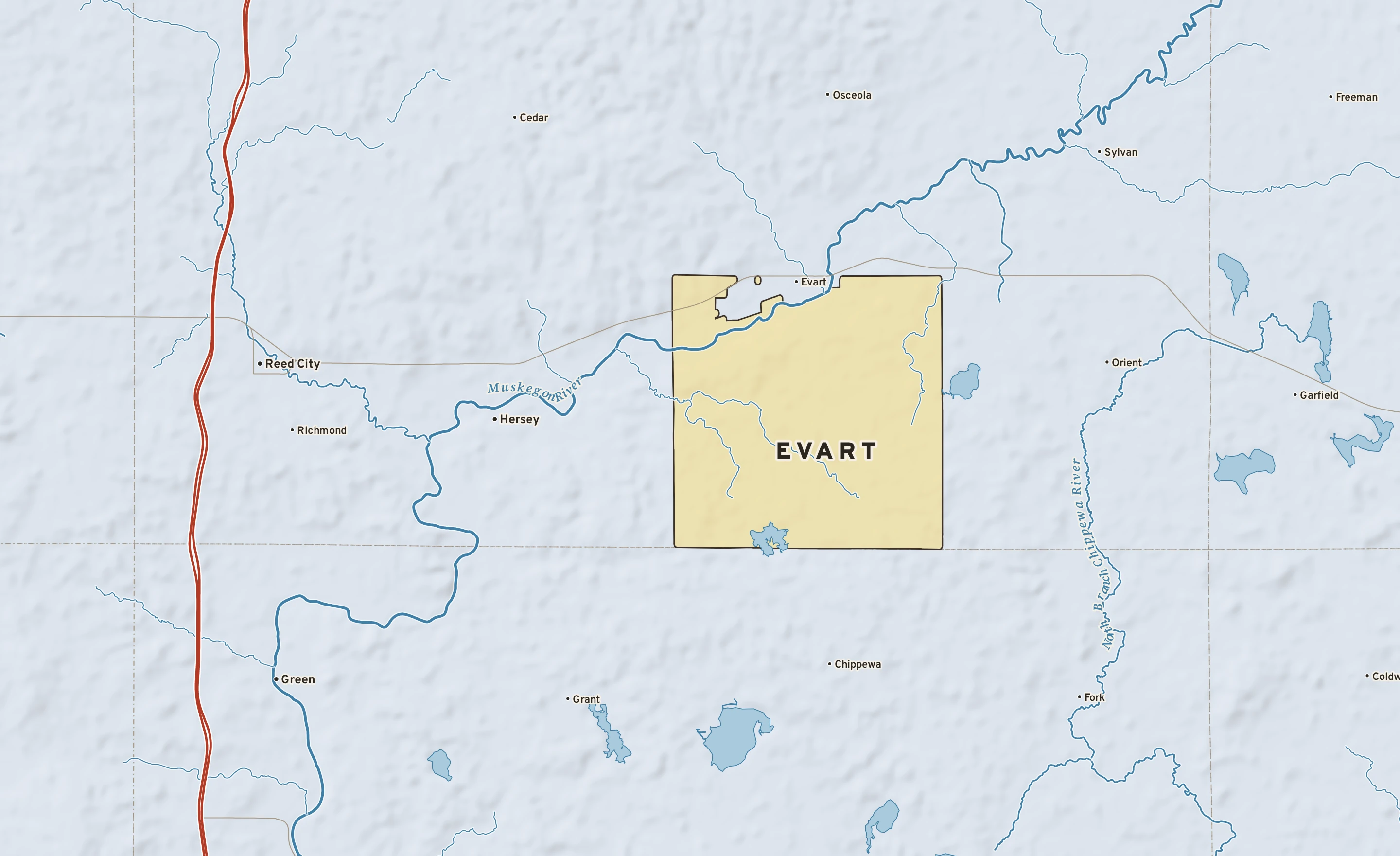 Shaded-relief atlas plate of Evart, Michigan: rivers, roads, the city limits and where the water drains.