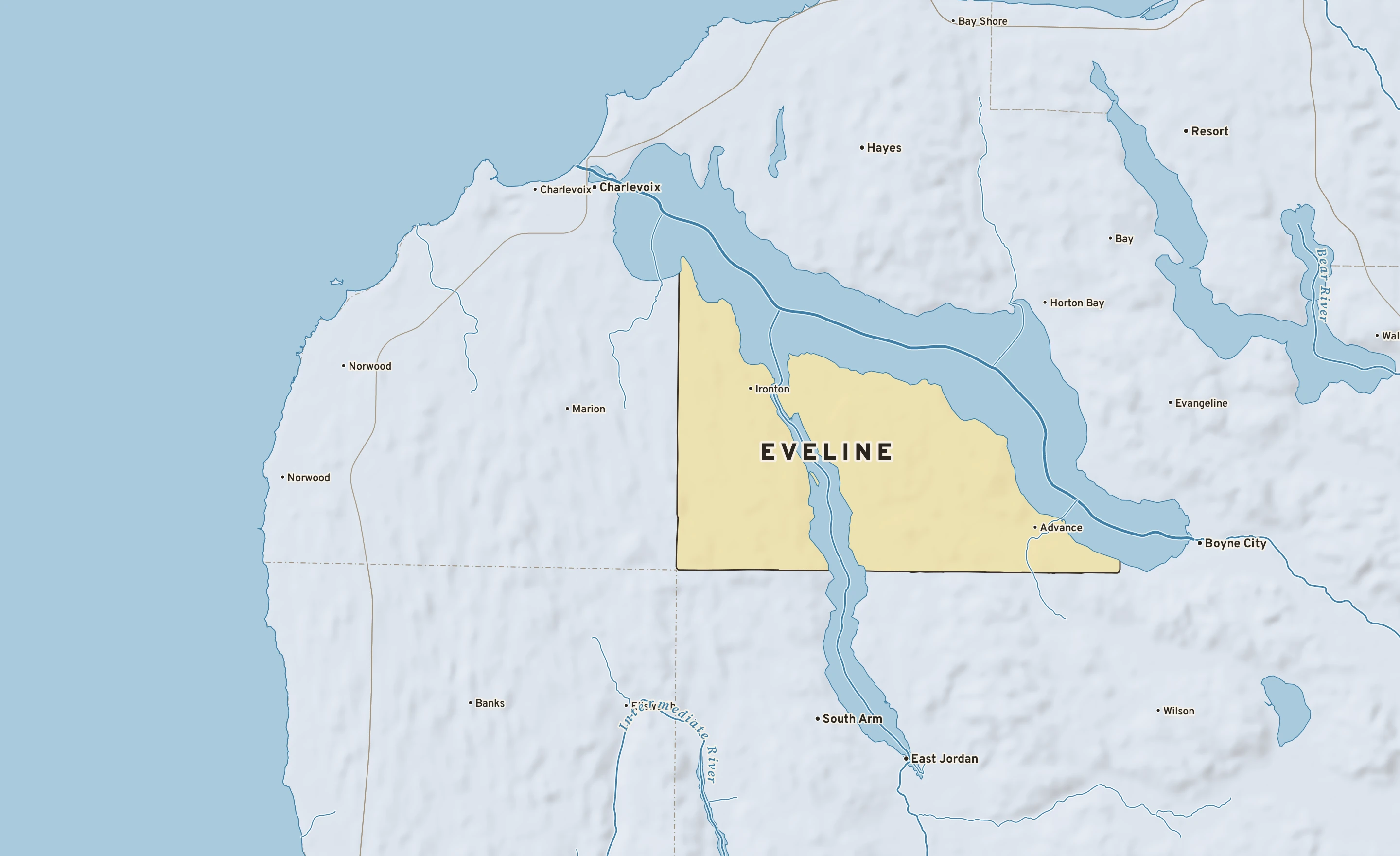 Shaded-relief atlas plate of Eveline, Michigan: rivers, roads, the city limits and where the water drains.