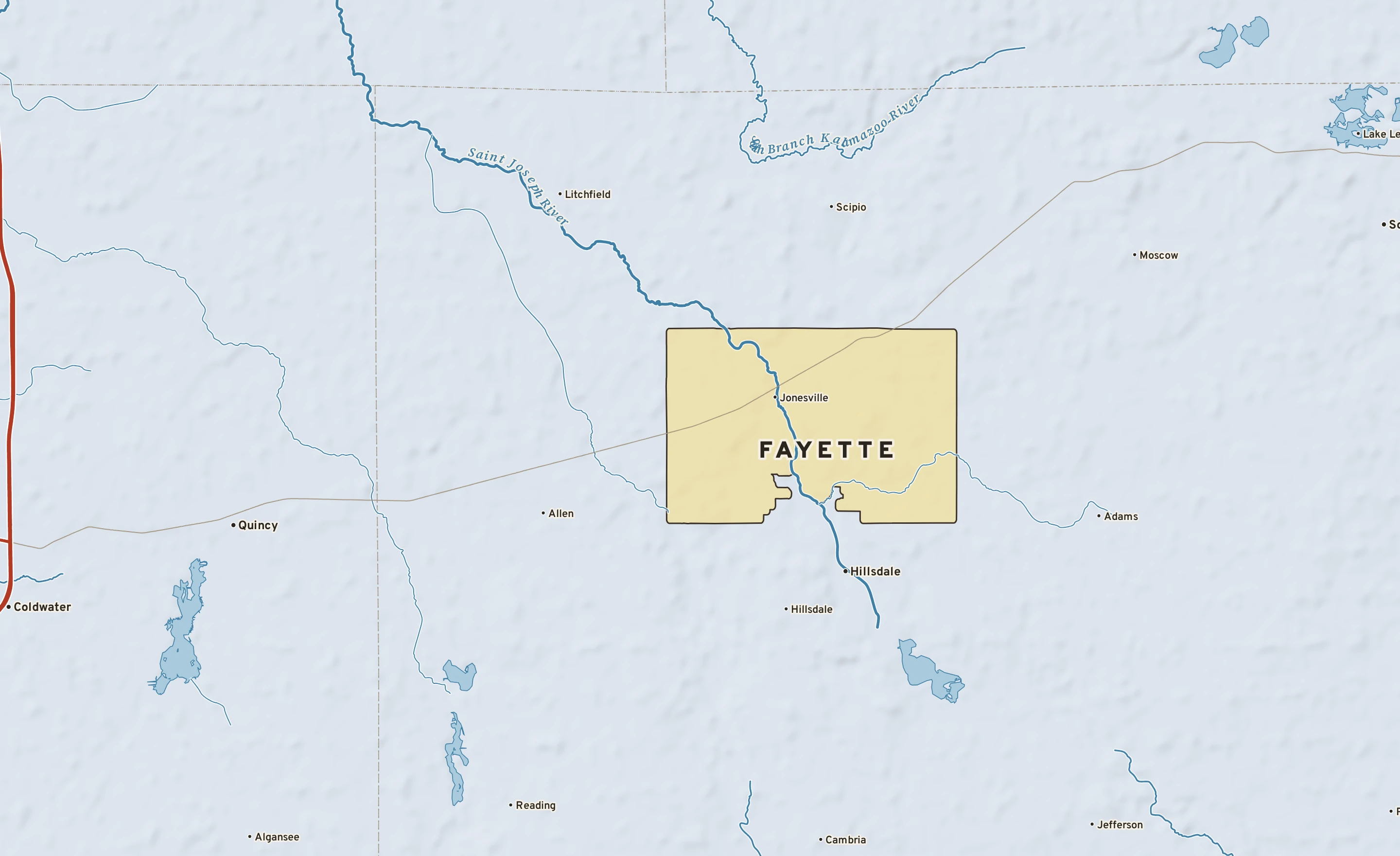 Shaded-relief atlas plate of Fayette, Michigan: rivers, roads, the city limits and where the water drains.