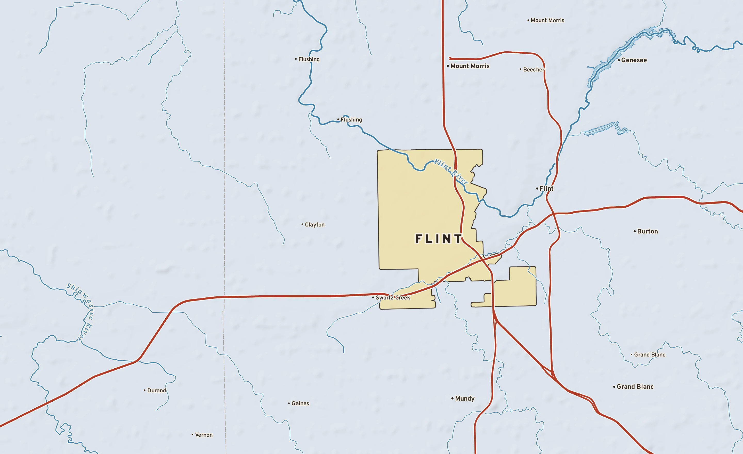 Shaded-relief atlas plate of Flint, Michigan: rivers, roads, the city limits and where the water drains.