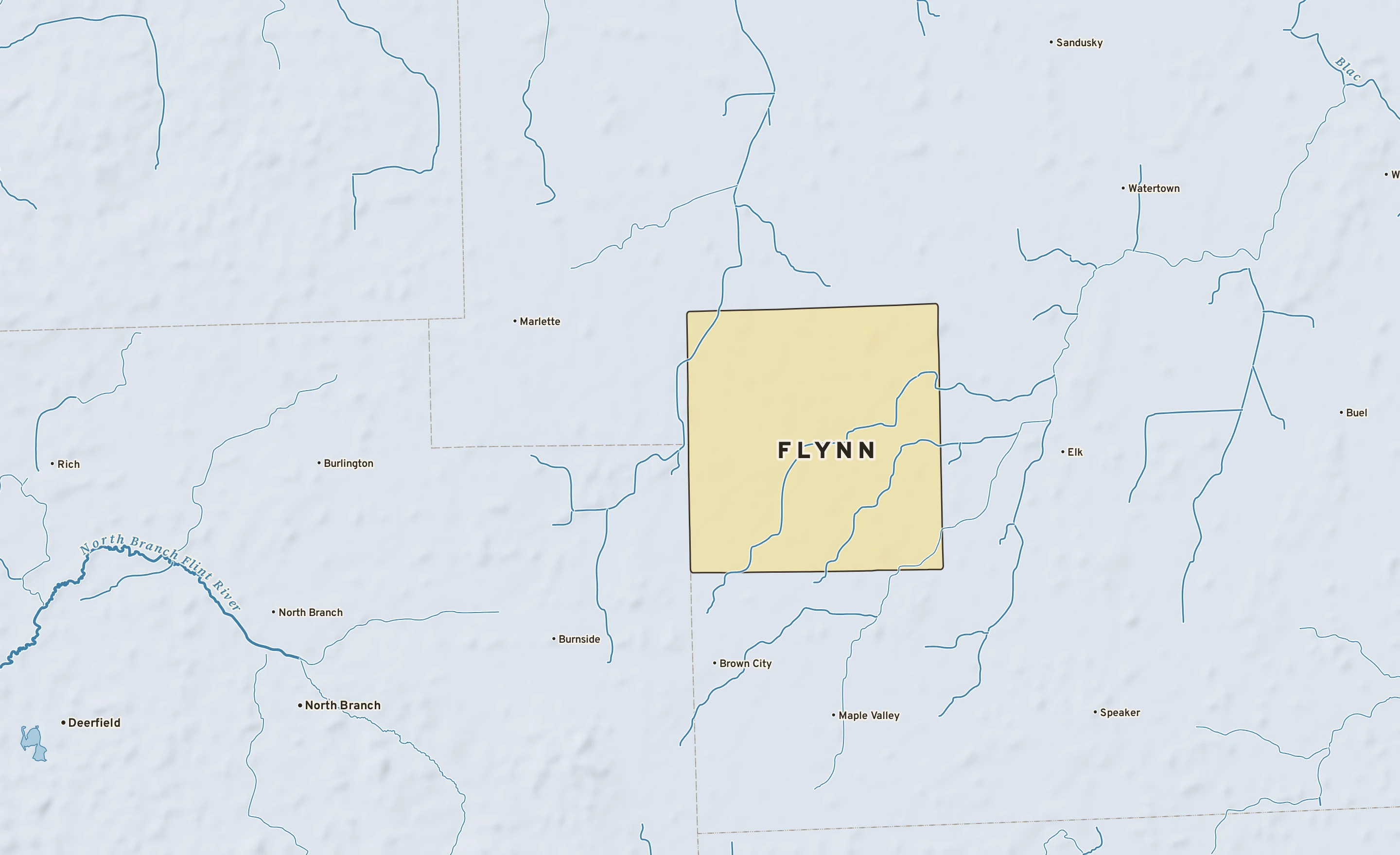 Shaded-relief atlas plate of Flynn, Michigan: rivers, roads, the city limits and where the water drains.