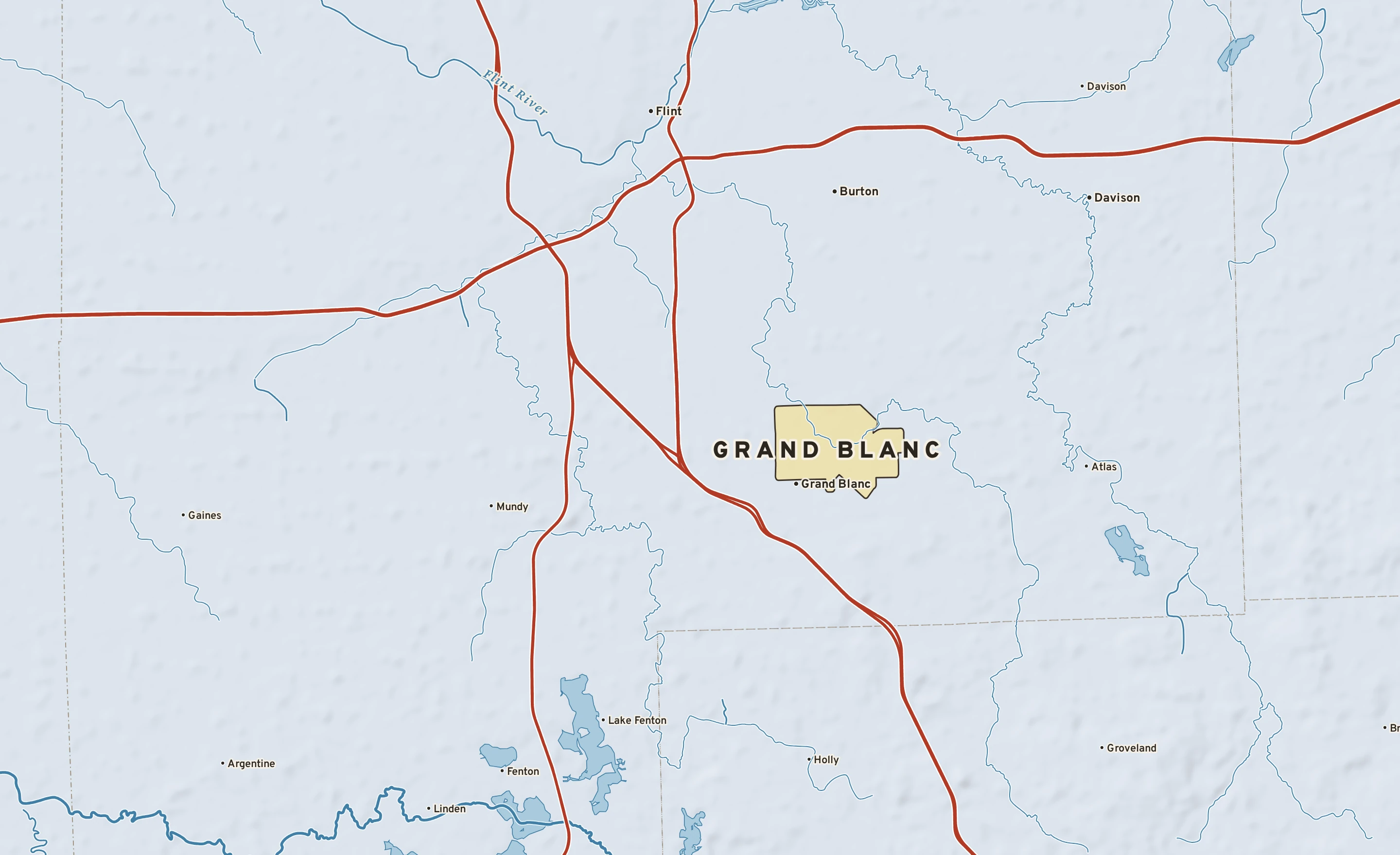 Shaded-relief atlas plate of Grand Blanc, Michigan: rivers, roads, the city limits and where the water drains.