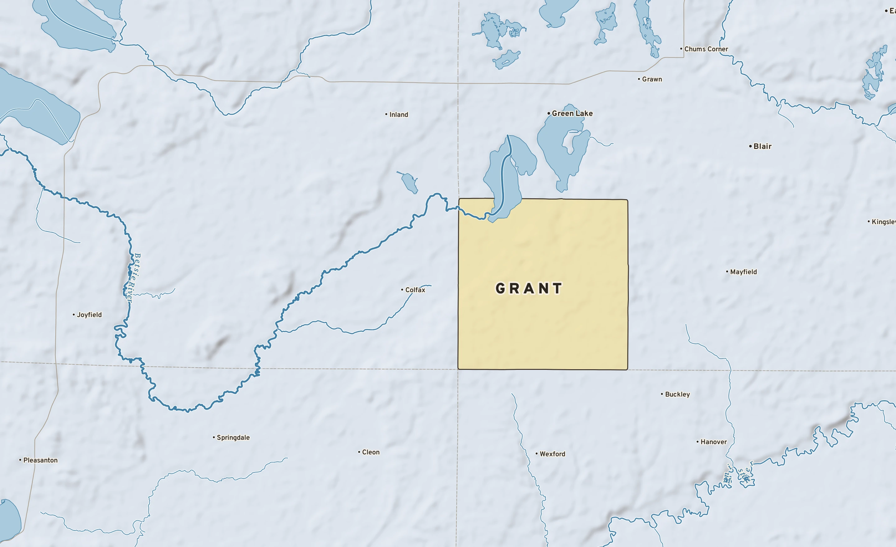 Shaded-relief atlas plate of Grant, Michigan: rivers, roads, the city limits and where the water drains.