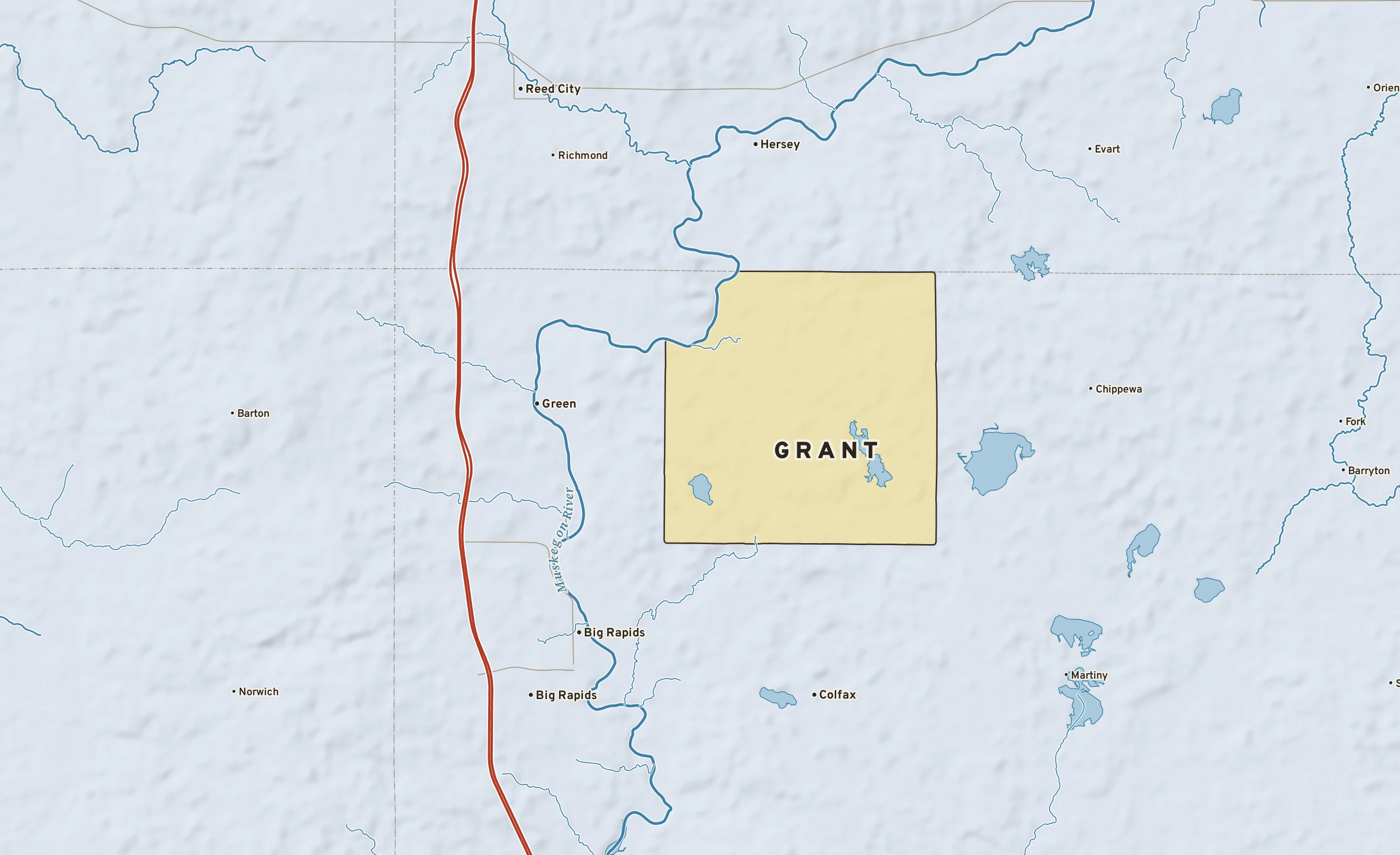 Shaded-relief atlas plate of Grant, Michigan: rivers, roads, the city limits and where the water drains.