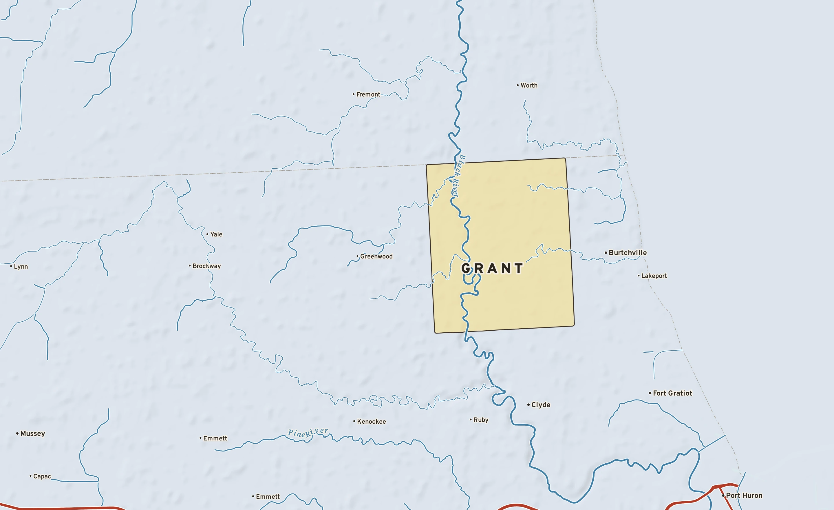 Shaded-relief atlas plate of Grant, Michigan: rivers, roads, the city limits and where the water drains.