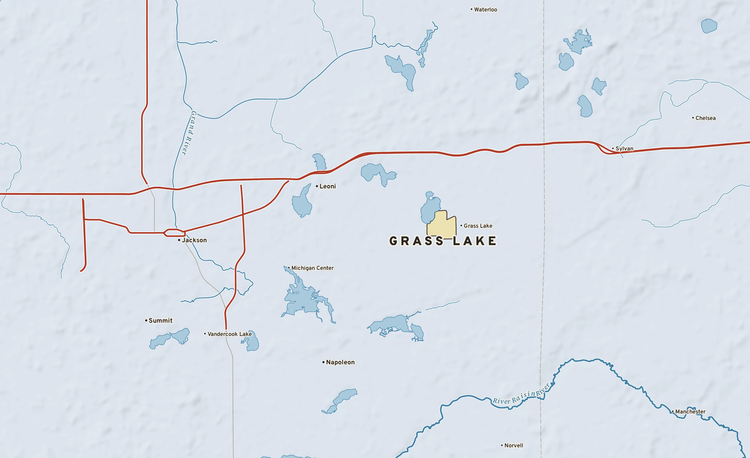 Shaded-relief atlas plate of Grass Lake, Michigan: rivers, roads, the city limits and where the water drains.