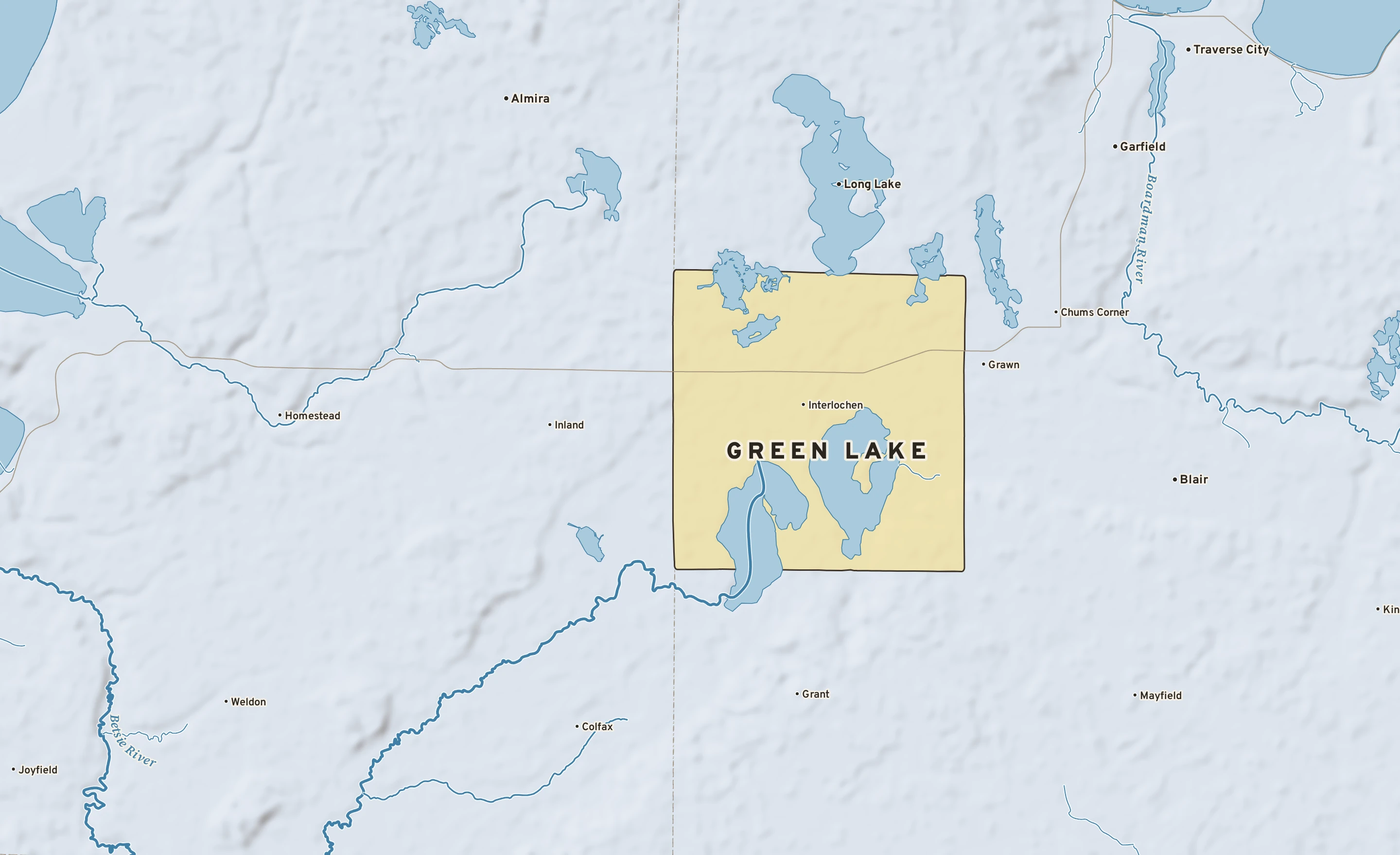 Shaded-relief atlas plate of Green Lake, Michigan: rivers, roads, the city limits and where the water drains.