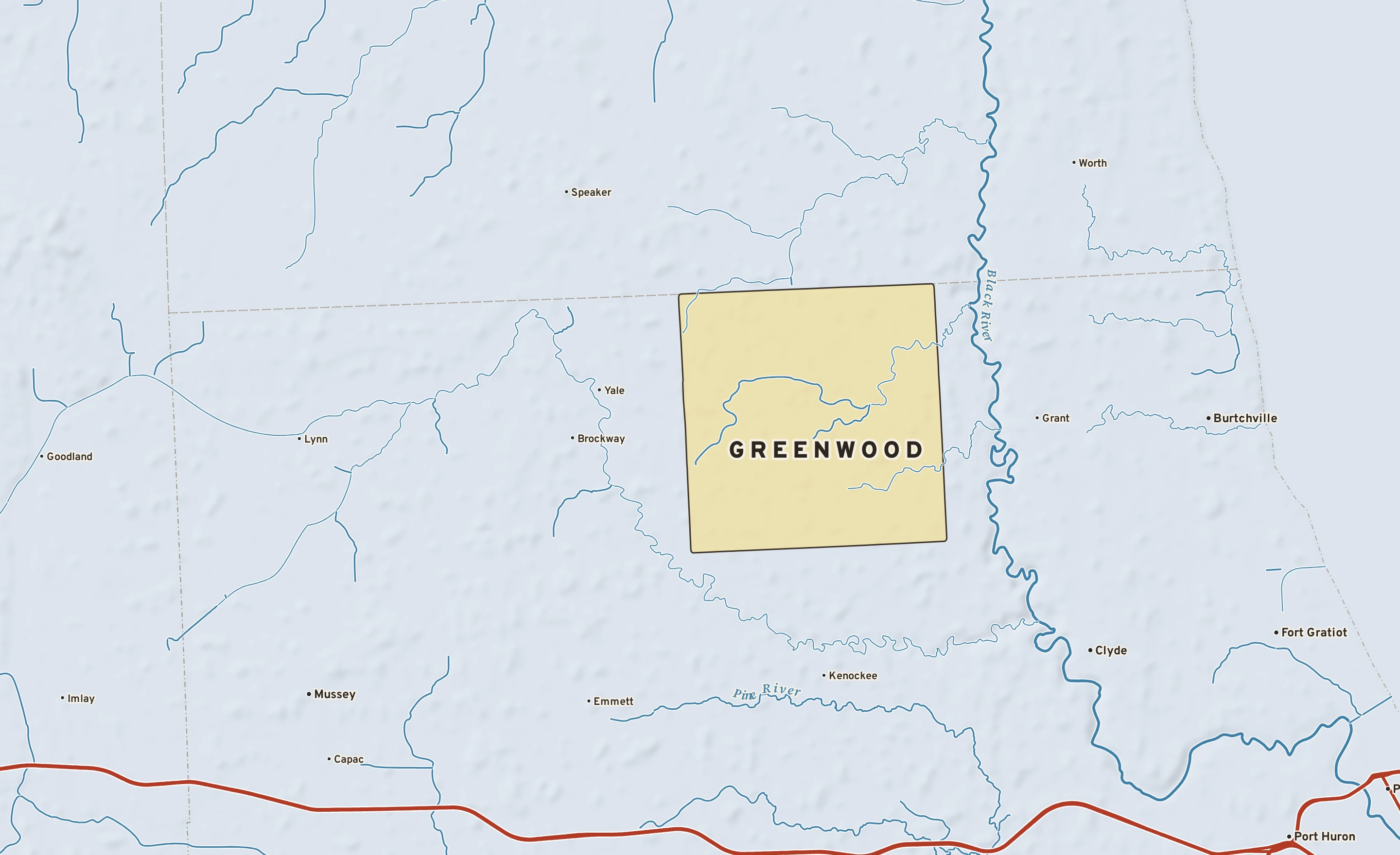 Shaded-relief atlas plate of Greenwood, Michigan: rivers, roads, the city limits and where the water drains.