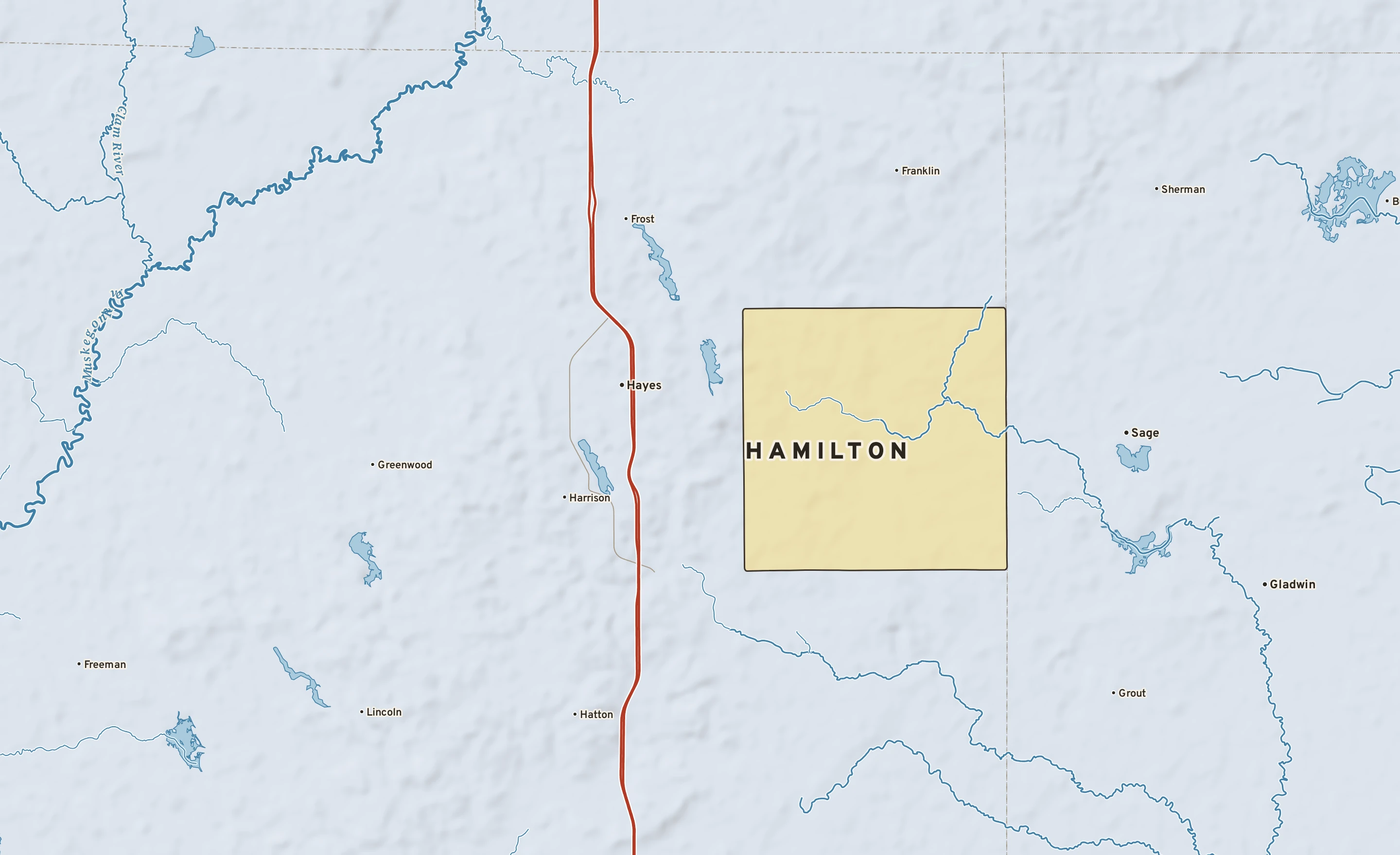 Shaded-relief atlas plate of Hamilton, Michigan: rivers, roads, the city limits and where the water drains.