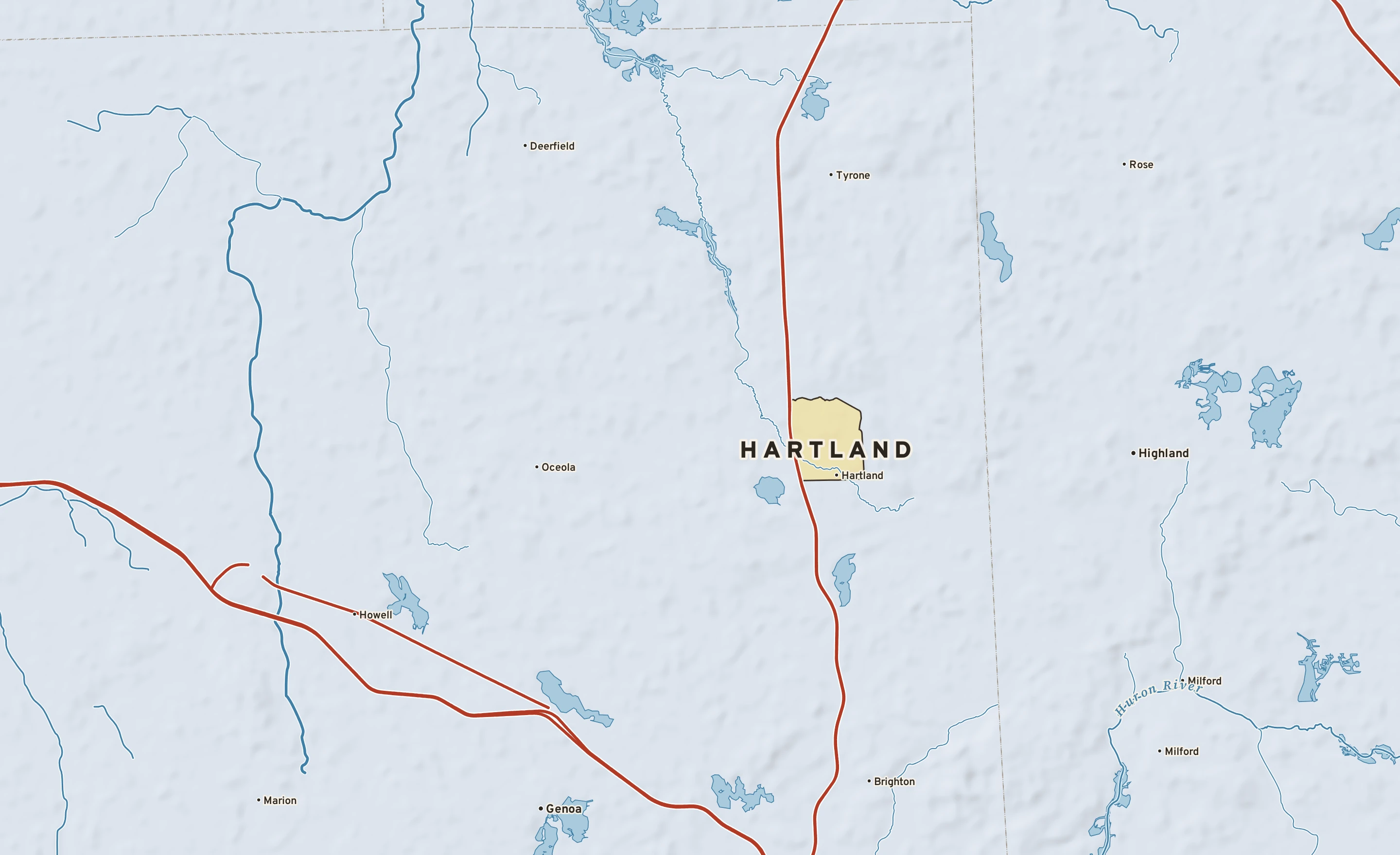 Shaded-relief atlas plate of Hartland, Michigan: rivers, roads, the city limits and where the water drains.