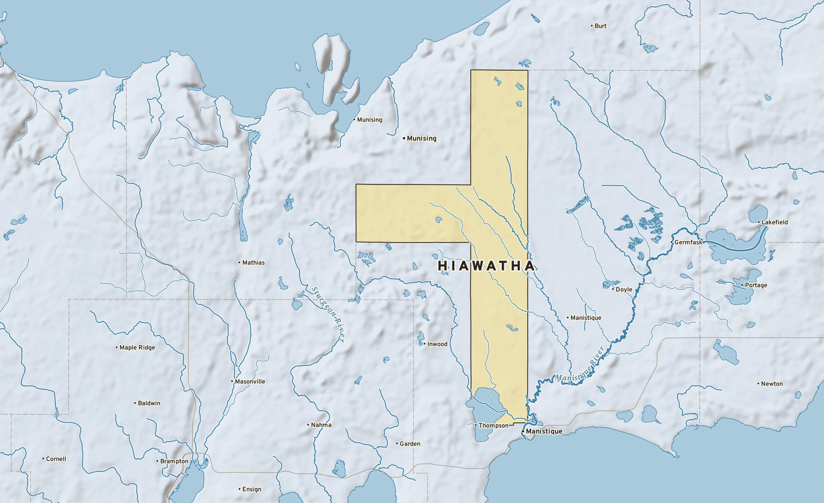 Shaded-relief atlas plate of Hiawatha, Michigan: rivers, roads, the city limits and where the water drains.