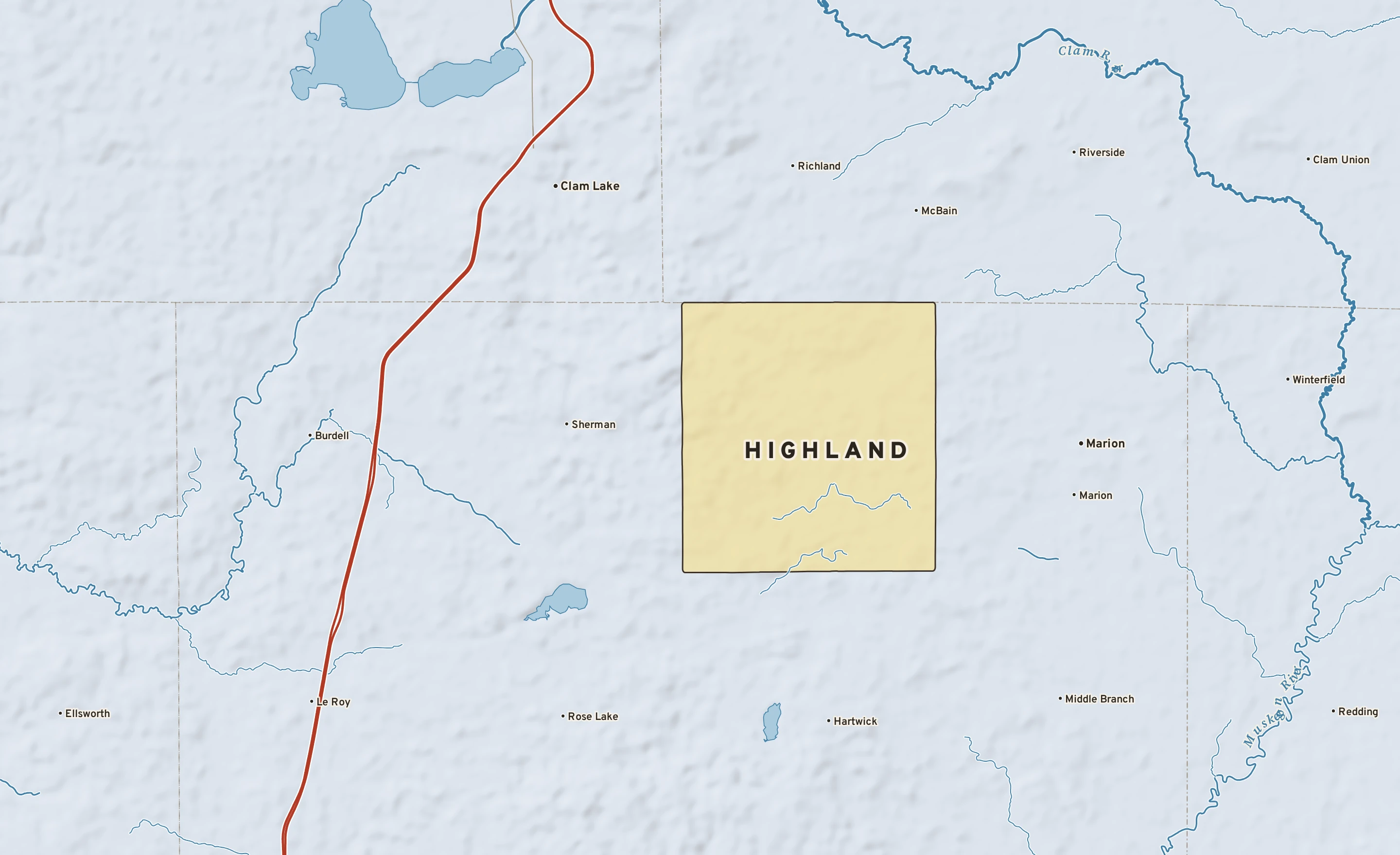 Shaded-relief atlas plate of Highland, Michigan: rivers, roads, the city limits and where the water drains.