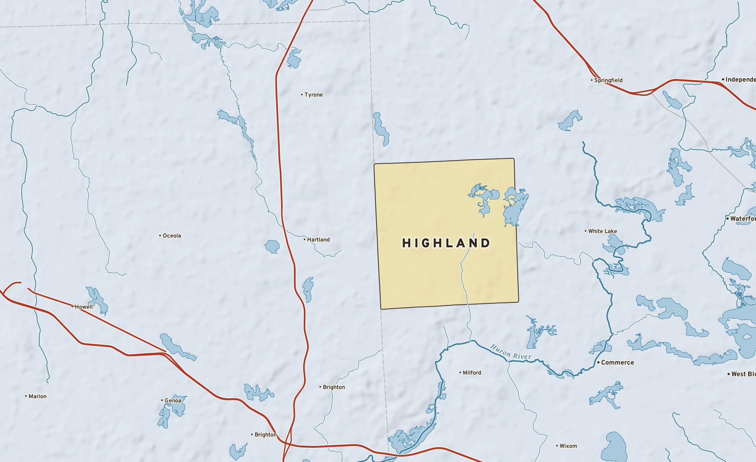 Shaded-relief atlas plate of Highland, Michigan: rivers, roads, the city limits and where the water drains.